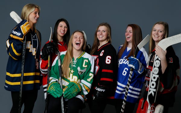 Player of the Year Taylor Williamson (No. 7 in green) of Edina held court with the rest of the Star Tribune Girls' Hockey All-Metro first team. They a