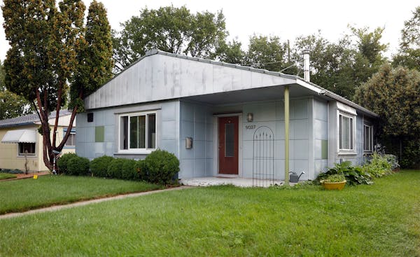 Buck Holzemer's all-steel Lustron house is one of six on Nicollet Avenue in south Minneapolis. Sleek porcelain-enameled steel panels cover the exterio