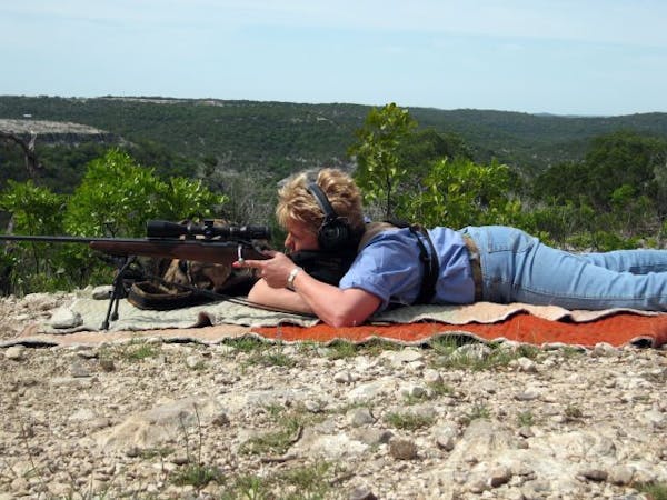 Betty Gaston demonstrated skills she learned at a special shooting school in Texas, where she was taught how to accurately shoot a rifle at long dista