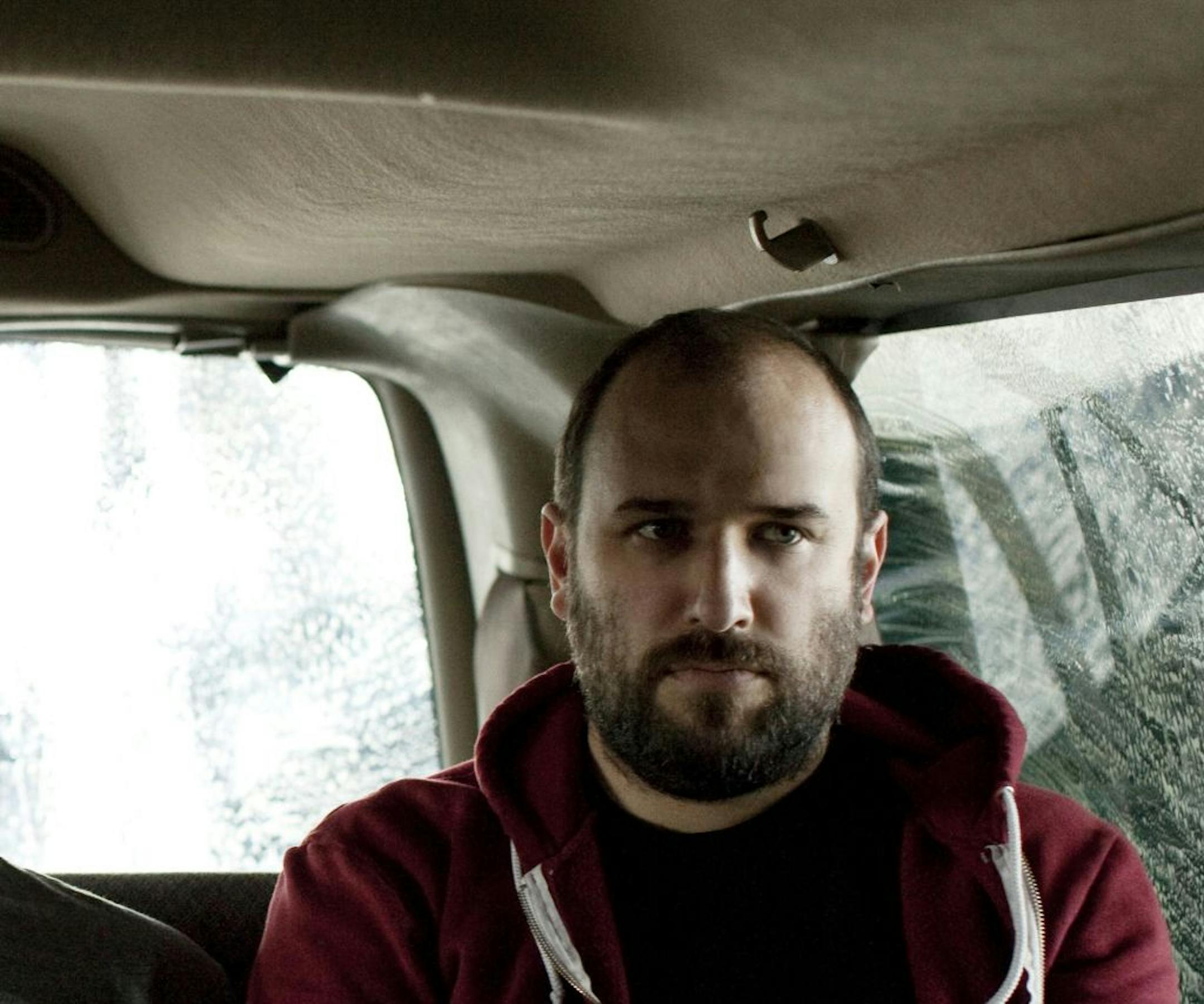 Publicity photo of David Bazan; Photo by JUCO (all caps one-name photographer).