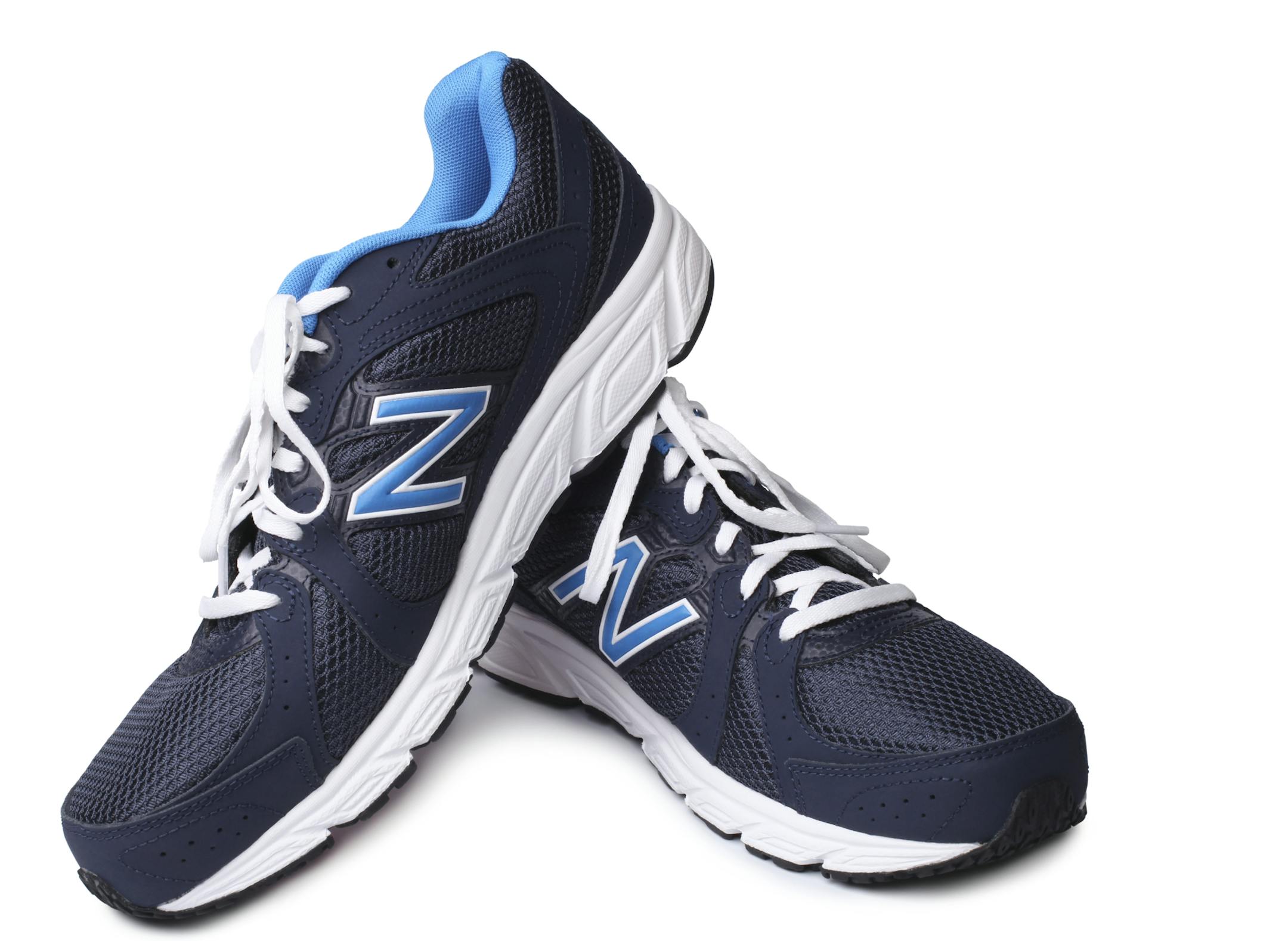 ST. PETERSBURG, RUSSIA - March 31, 2014: New Balance Athletic Shoes on white background