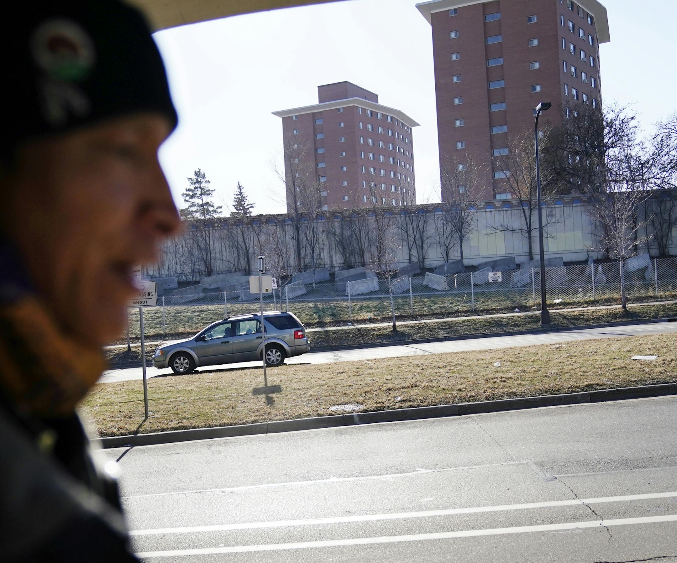 Allen Touche, 48, walks along Franklin Avenue, across from a stretch of land know as the Wall of Forgotten Natives where Touche and many other homeless Natives lived in tents briefly this summer. Touche was making his weekly Saturday journey from his current residence in South St. Paul to Minneapolis to help feed homeless Natives and others in Minneapolis.