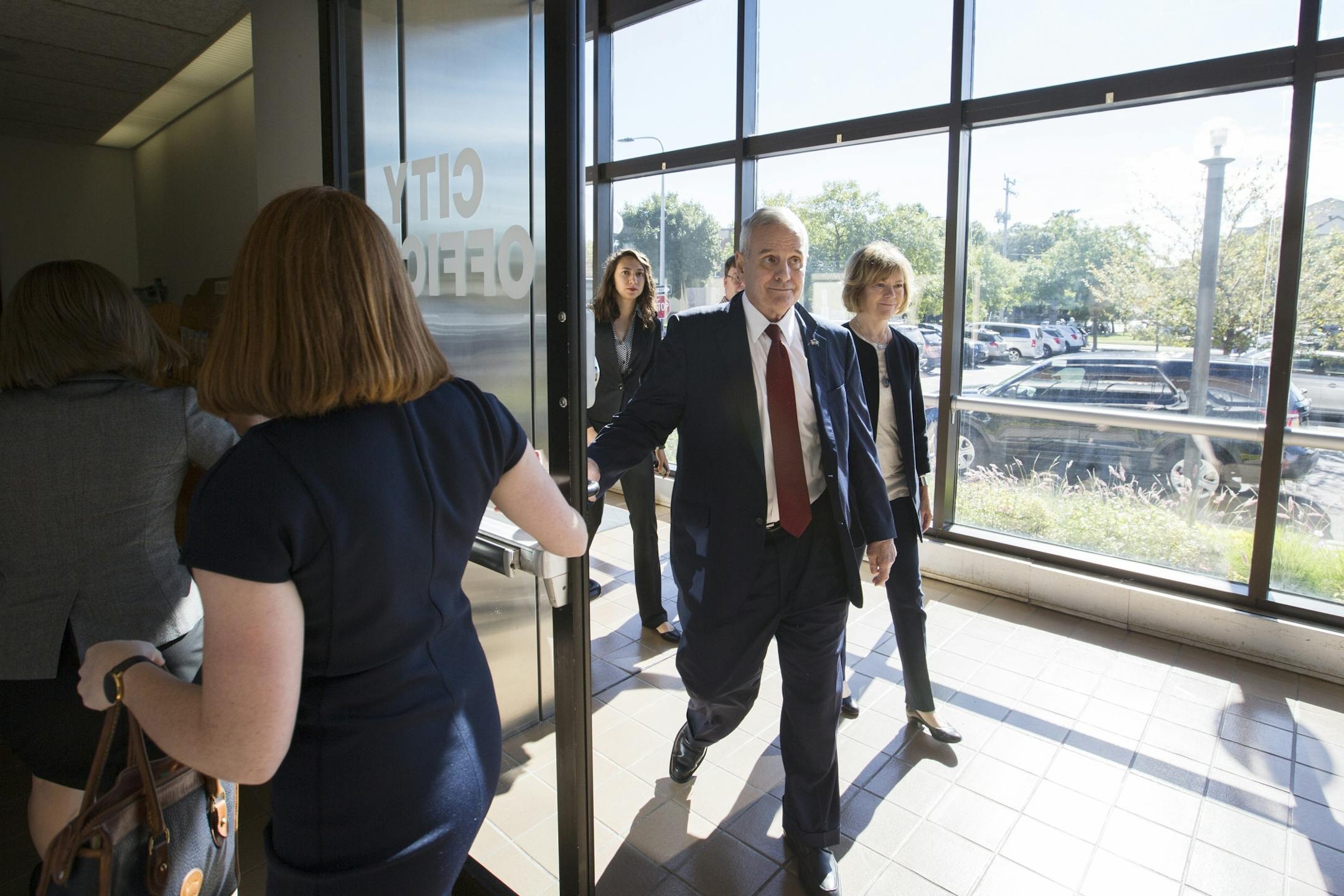 Governor Mark Dayton and Lt. Governor Tina Smith arrive for a meeting with local officials at St. Cloud City Hall.
