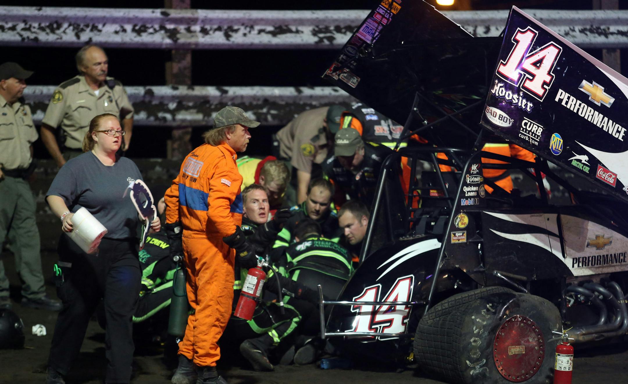 In this Aug. 5, personnel prepared to load NASCAR driver Tony Stewart into an ambulance after he was involved in a four-car wreck at Southern Iowa Speedway in Oskaloosa, Iowa. Stewart suffered a broken right tibia and fibula in the wreck.