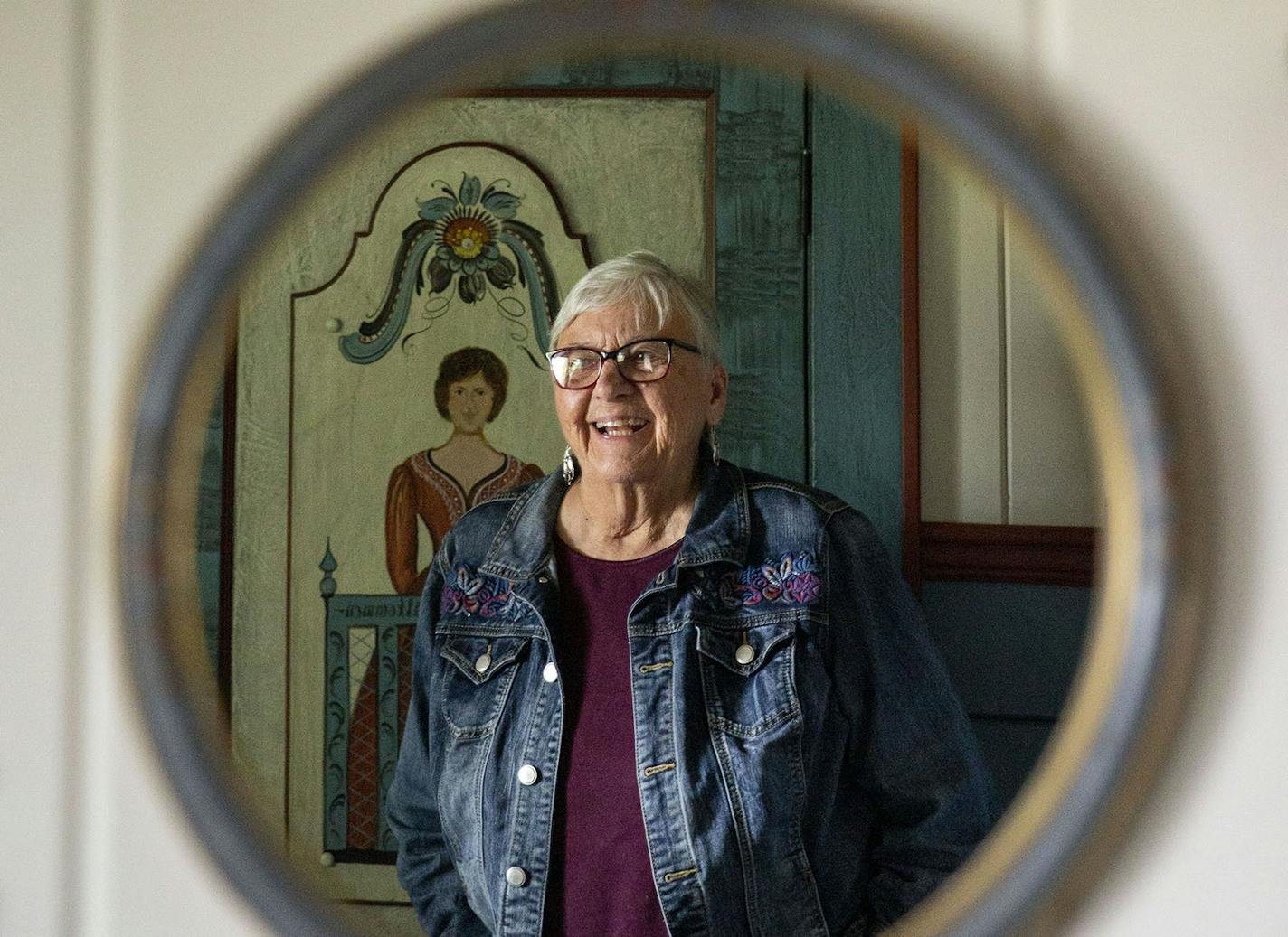 Karen Jenson is reflected in a small hanging mirror in the Swedish room. ALEX KORMANN &#xa5; alex.kormann@startribune.com Karen Jenson is an 82-year-old artist who spent most of her life mastering the Norwegian and Swedish painting styles of rosemaling and dalamaling, respectively. She no longer lives in the home and is in the process of transforming it into a museum or artist's residence.