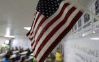 A teacher uses the Pledge of Allegiance in a reading class the U.S. government's newest holding center for migrant children in Carrizo Springs, Texas,