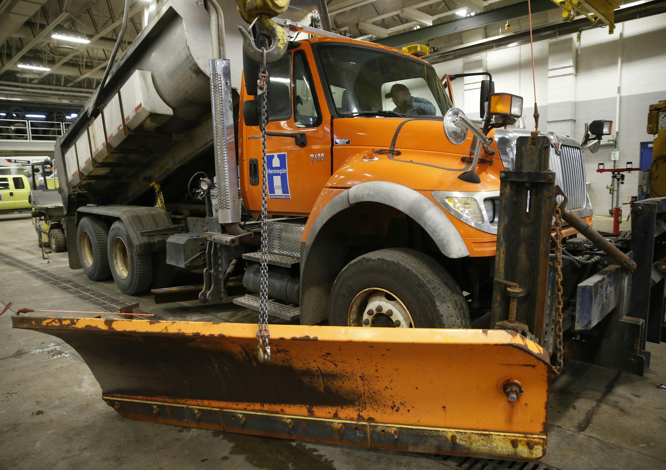 The Hennepin County trucks that become snowplows are used in summer road construction, making the preparation process a balancing act. Crew used to start the changeover in September, but after the 1991 Halloween blizzard, the start time was moved up to mid-August.