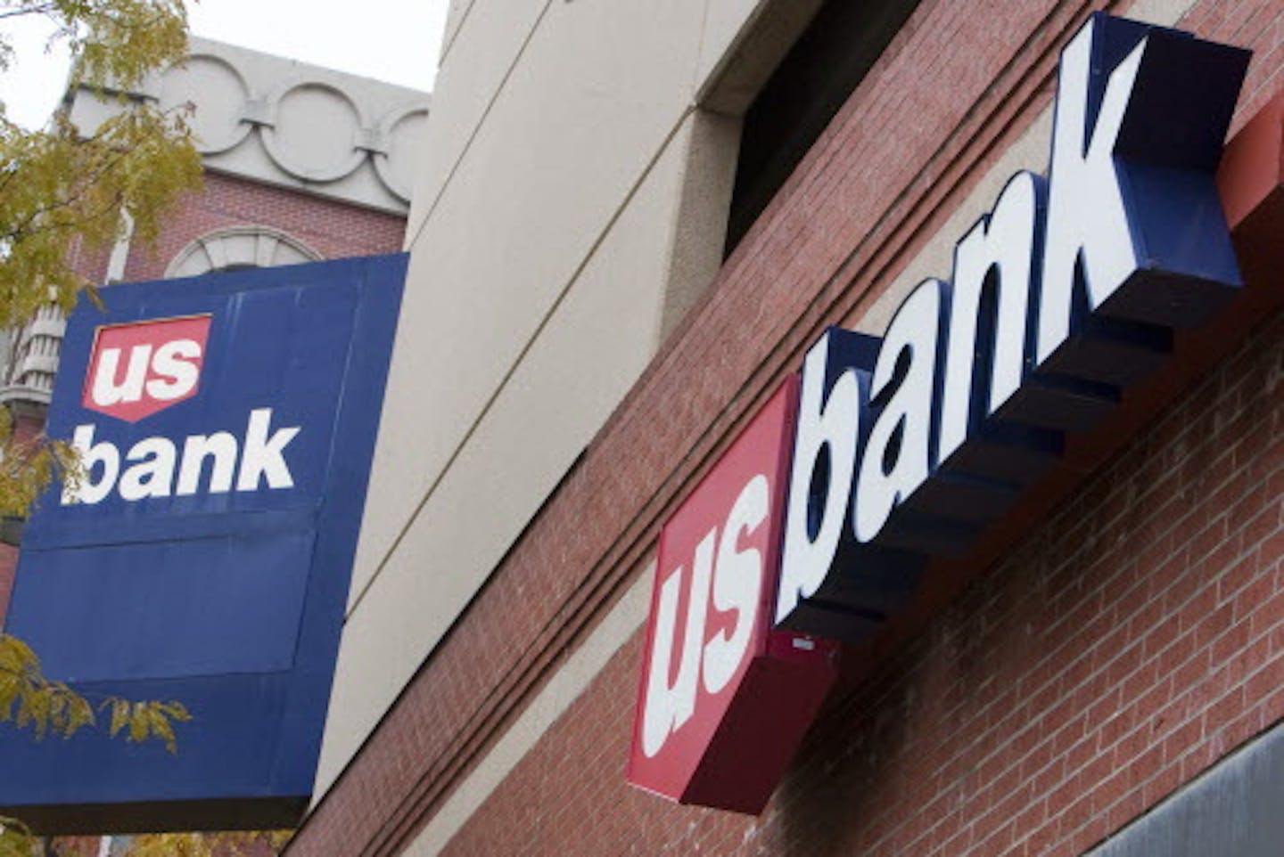 FILE - In this Oct. 20, 2009 file photo, signs on a US Bank branch in Omaha, Neb. are shown Tuesday, Oct. 20, 2009. U.S. Bancorp said Wednesday, Jan. 20, 2010, its fourth-quarter profit more than doubled from a year ago, as mortgage banking revenue grew.(AP Photo/Nati Harnik, File)