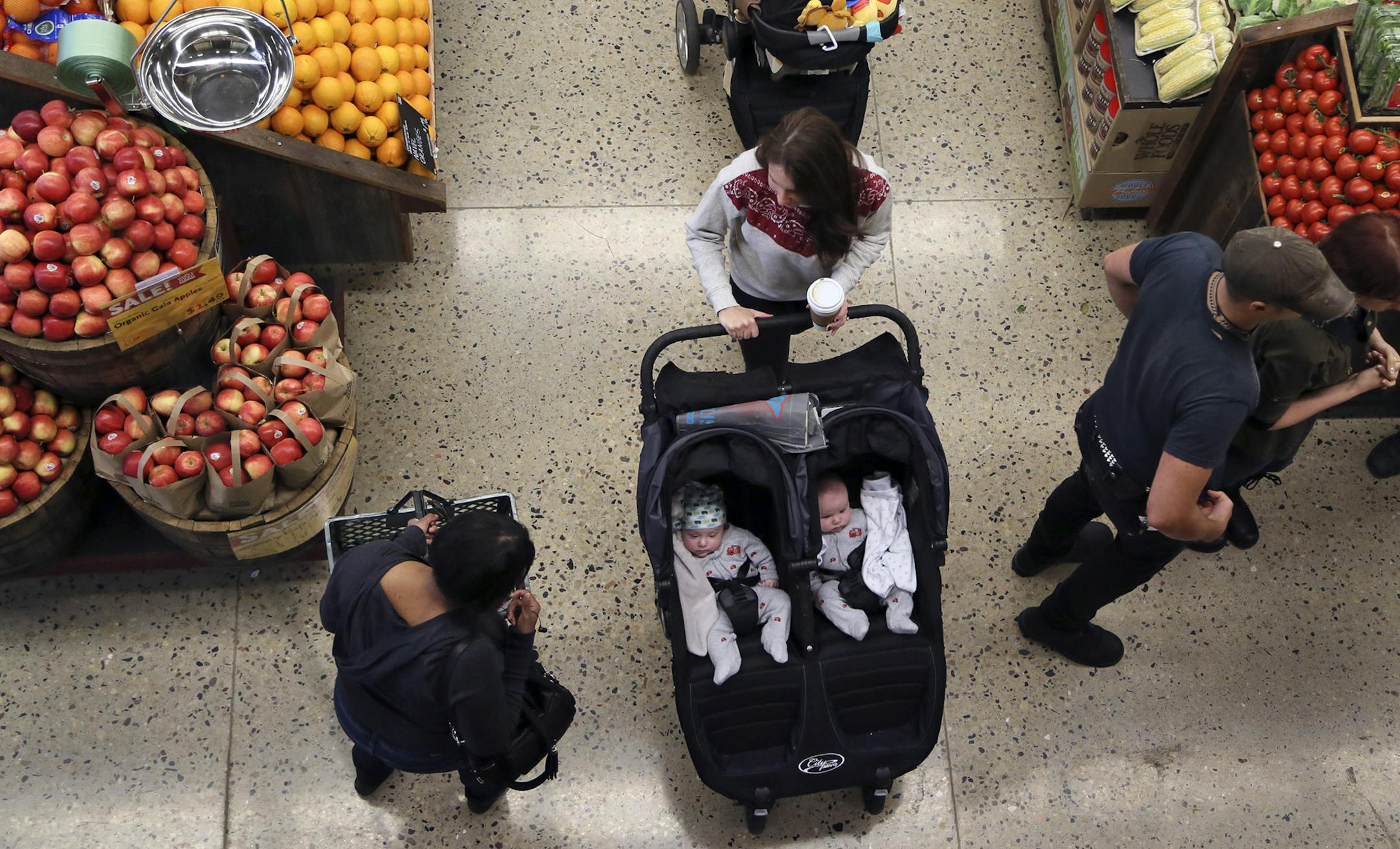 Shoppers young, old and in-between clogged the aisles Wednesday, Sept. 25, 2013, during the grand opening of the Whole Foods store in downtown Minneapolis, MN.](DAVID JOLES/STARTRIBUNE) djoles@startribune.com The Whole Foods store in downtown Minneapolis isn't the city's first urban grocery store - downtown is book-ended by two Lund's stores at nearly opposite ends of Hennepin Avenue. But the arrival of the store represents a significant moment in the transformation of the once-sleepy North Loop