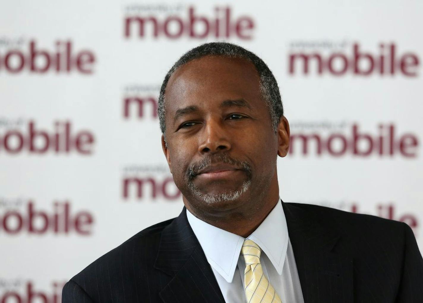 Republican 2016 presidential candidate Ben Carson speaks to the media at the Arthur Outlaw Mobile Convention Center in Mobile, Ala., before he was to deliver a speech at a fundraising dinner for the University of Mobile, Thursday, April 30, 2015, in Mobile, Ala. Carson is a retired neurosurgeon turned conservative star. (Mike Brantley/AL.com via AP) MAGS OUT; MANDATORY CREDIT