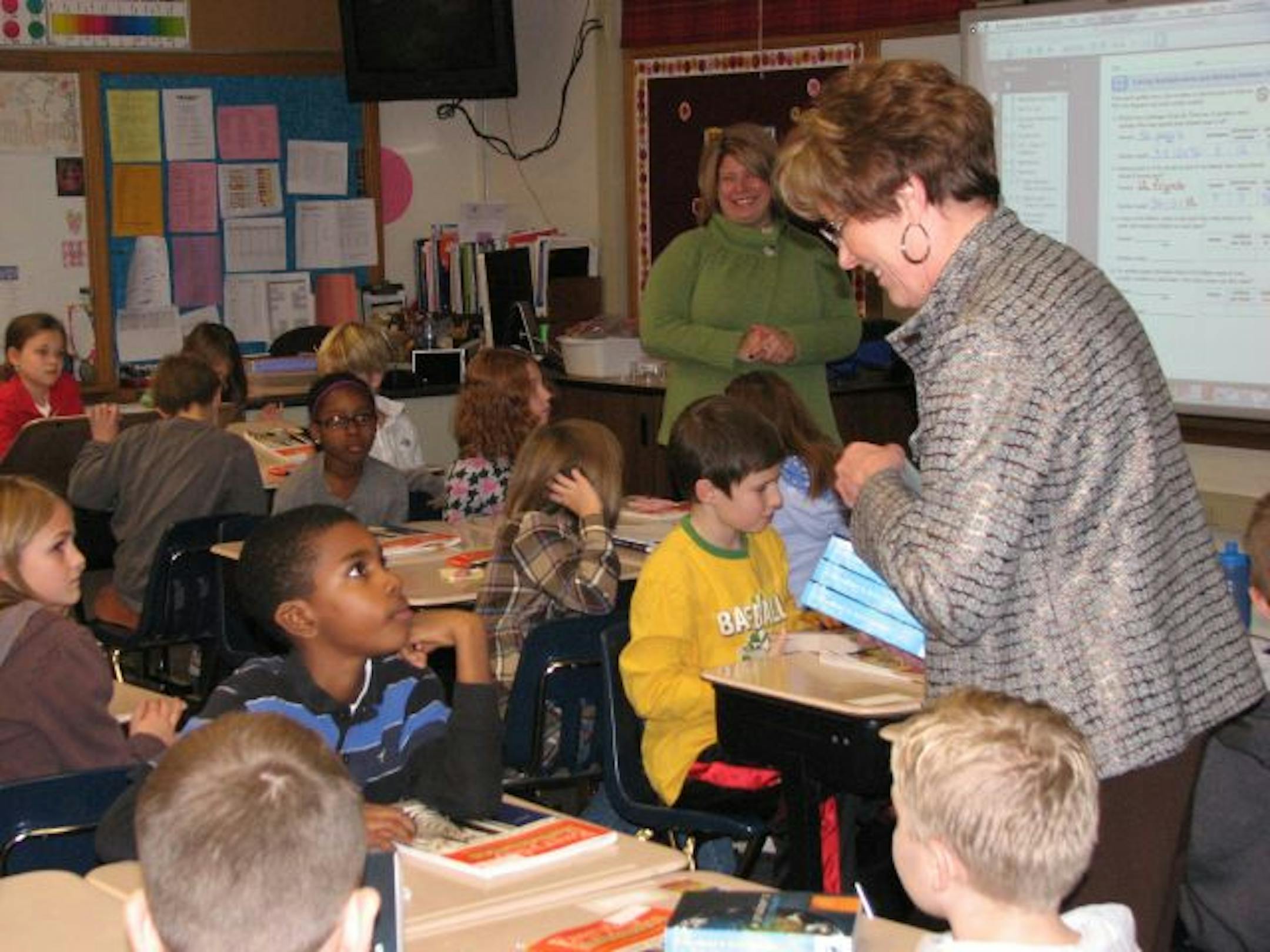 Kathryn Giegler distributed dictionaries from the Anoka Rotary Club to Champlin Elementary School students during this year's edition of the National Dictionary Project.