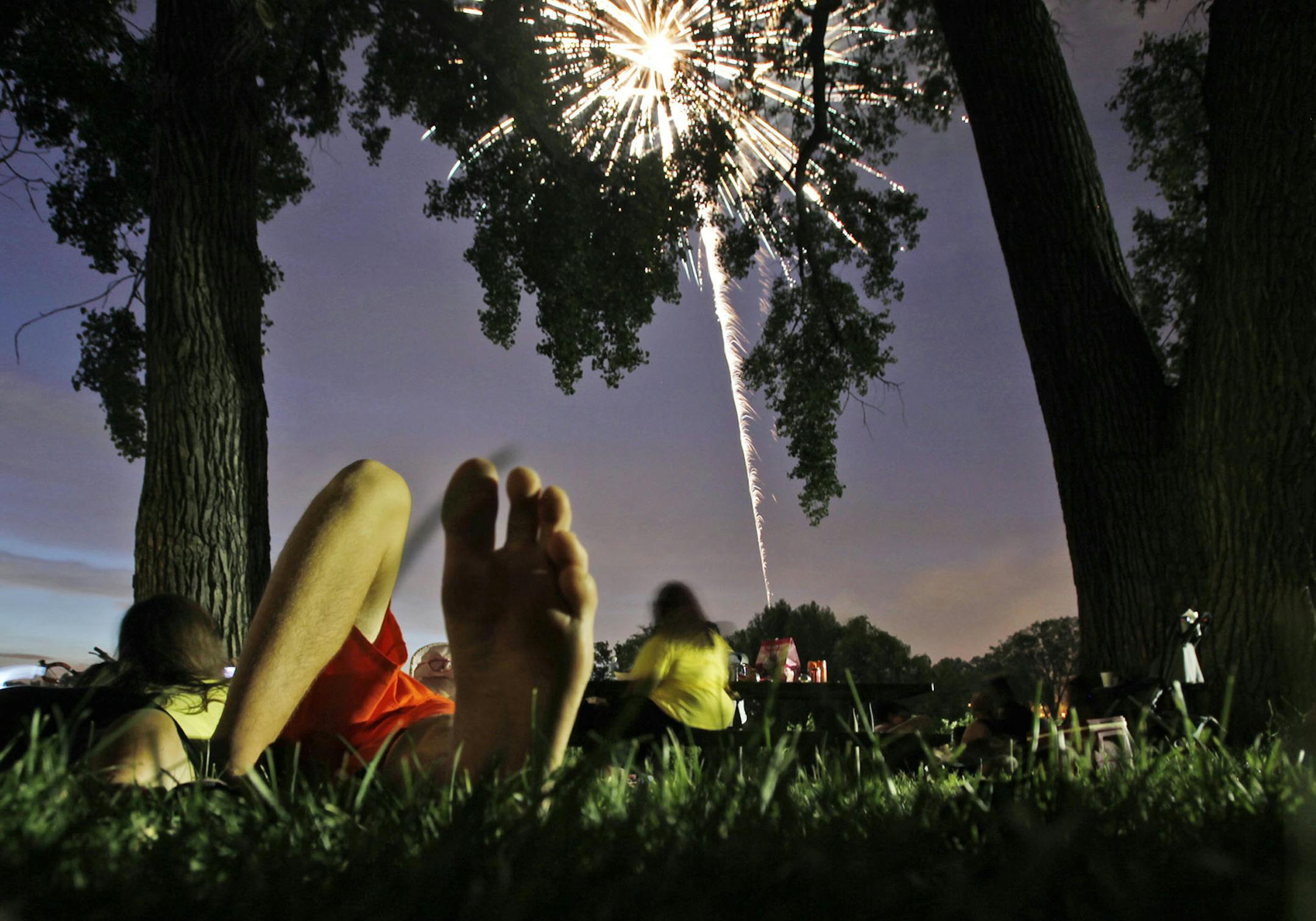 DAVID JOLES • djoles@startribune.com Minneapolis, MN - July 4, 2010- The soft grass of Powderhorn Park was a perfect spot to watch Fourth of July fireworks in the park. ORG XMIT: MIN2013062814314949