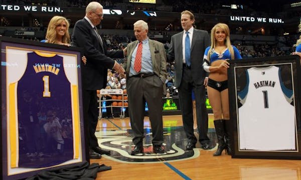 Lakers coach Phil Jackson (left) shook hands with Sid Hartman during a pregame presentation honoring Hartman as Wolves coach Kurt Rambis looked on.