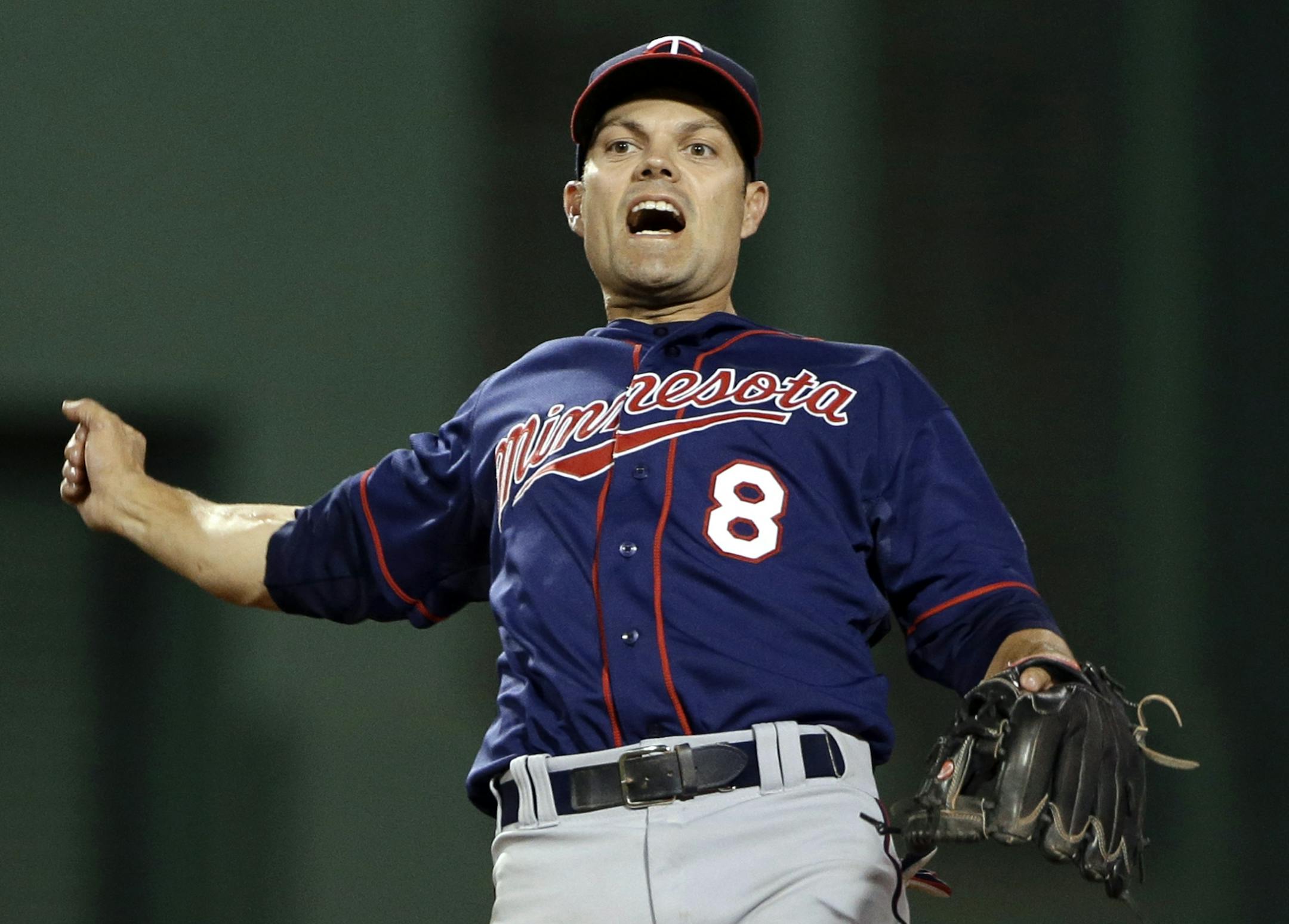 Minnesota Twins shortstop Jamey Carroll celebrates after turning a double play against the Boston Red Sox on May 7, 2013.