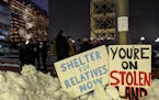 American Indian activists began to assemble outside the Hennepin County Government Center on Friday night to demand more emergency shelter beds for pe