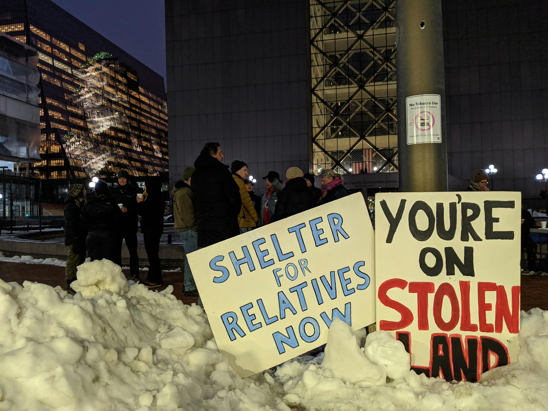 American Indian activists began to assemble outside the Hennepin County Government Center on Friday night to demand more emergency shelter beds for people experiencing homelessness.