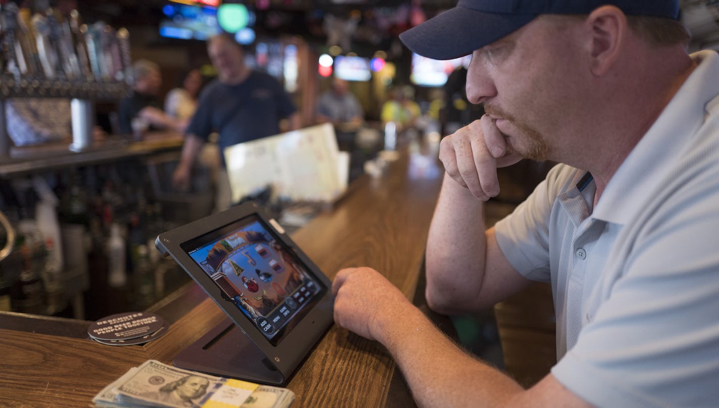 Jay Hazeman played electronic pull-tabs at the 1029 bar Tuesday May 1, 2018. ] JERRY HOLT &#xef; jerry.holt@startribune.com