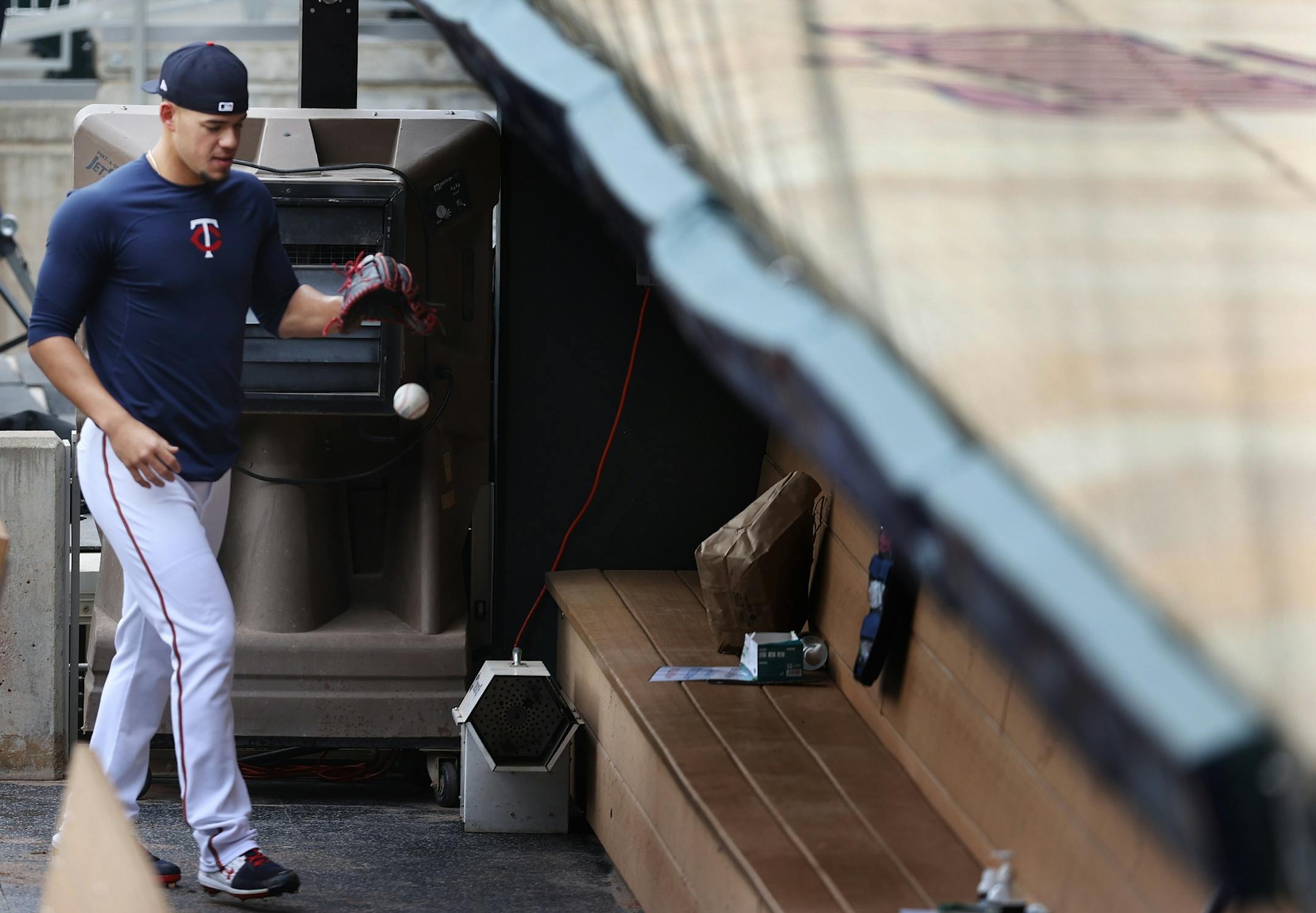 Minnesota Twins starting pitcher Jose Berrios (17) walked though the dugout during practice .