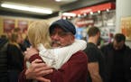 Anne Berg, and her dad, Donald Egerer, left, were among those who came into Penn Cycle at closing to wish the best for owner Pat Sorenson. Berg's dad 