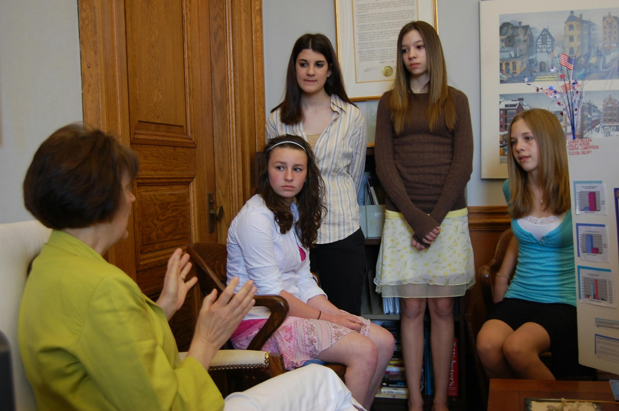 Sen. Sandy Pappas, DFL - St. Paul, listened to John Glenn Middle School students Haley Husom, Olivia Drury, Lauren Becker and Sarah Jorgenson present their project to lower the voting age to 16.