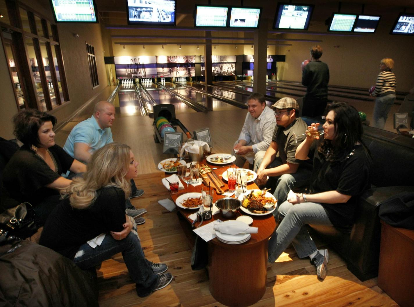 Edina's new spot, Pinstripes, includes a high-end restaurant, bowling alley and bocce ball courts. Tables behind the lanes have full service from the bistro.