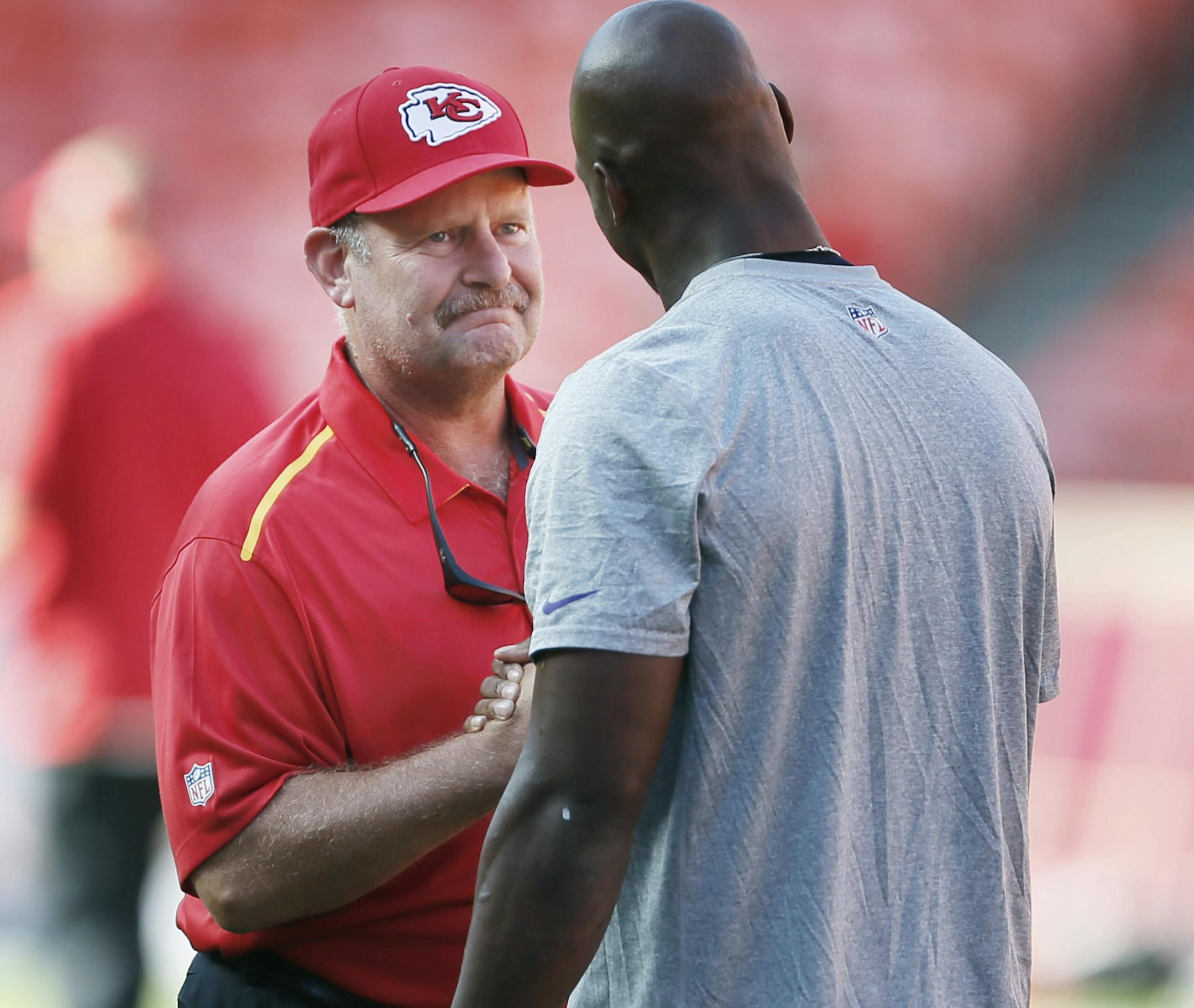 Former Vikings head coach Brad Childress says hello to Vikings running back Adrian Peterson (28) during pre game warmups between the Minnesota Vikings and Kansas City Chiefs Saturday August 23 , 2014 in Kansas City ,MO . ] Jerry Holt Jerry.holt@startribune.com