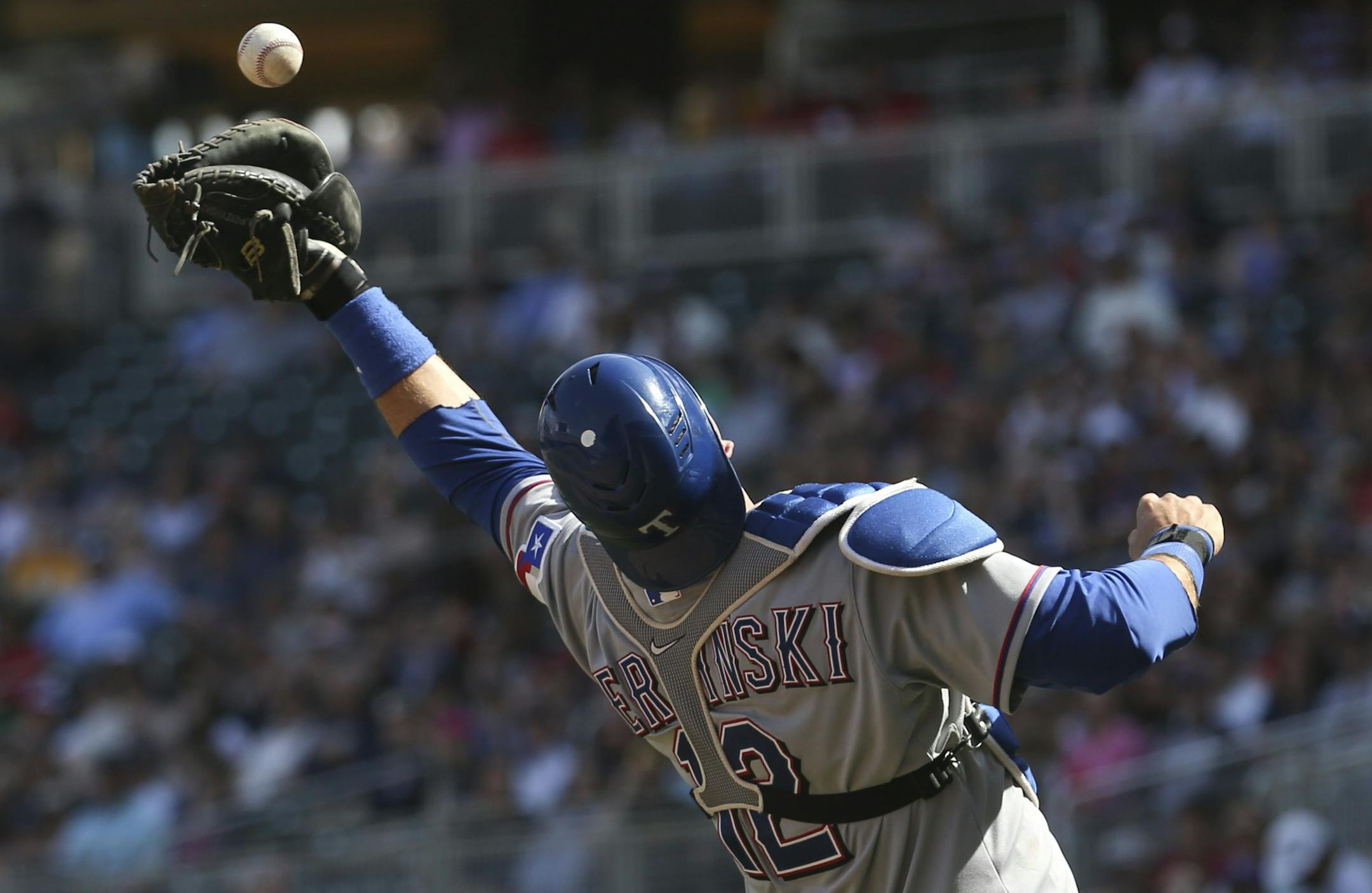 A.J. Pierzynski #12 of the Texas Rangers bobbled the ball but made the catch on a pop up fromJosh Willingham #16 of the Minnesota Twins in the eighth inning at Target Field in Minneapolis Min., Sunday, April 28, 2013. Twins won 5-0 over Texas.