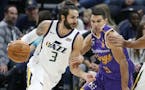 Utah Jazz guard Ricky Rubio (3) drives around Sydney Kings guard Kevin Lisch (11) during the first half of a preseason NBA basketball game Monday, Oct