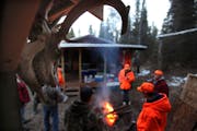 Thirteen deer hunters gathered at this camp near Tower, Minn., in 2012. Two of the hunters also had permits to shoot a wolf. 