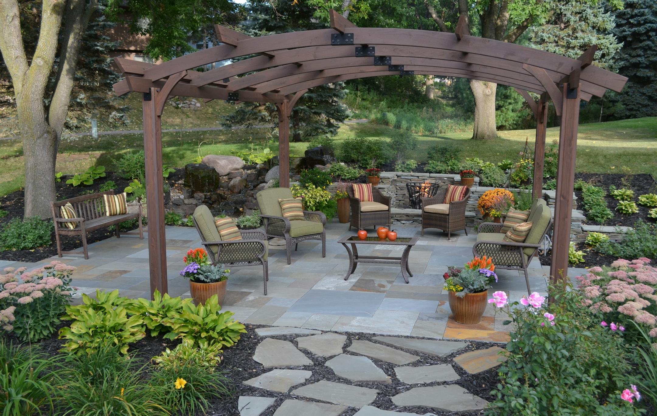 Before and After - New patio and landscaping in the backyard of an Eden Prairie home by Bachmans.