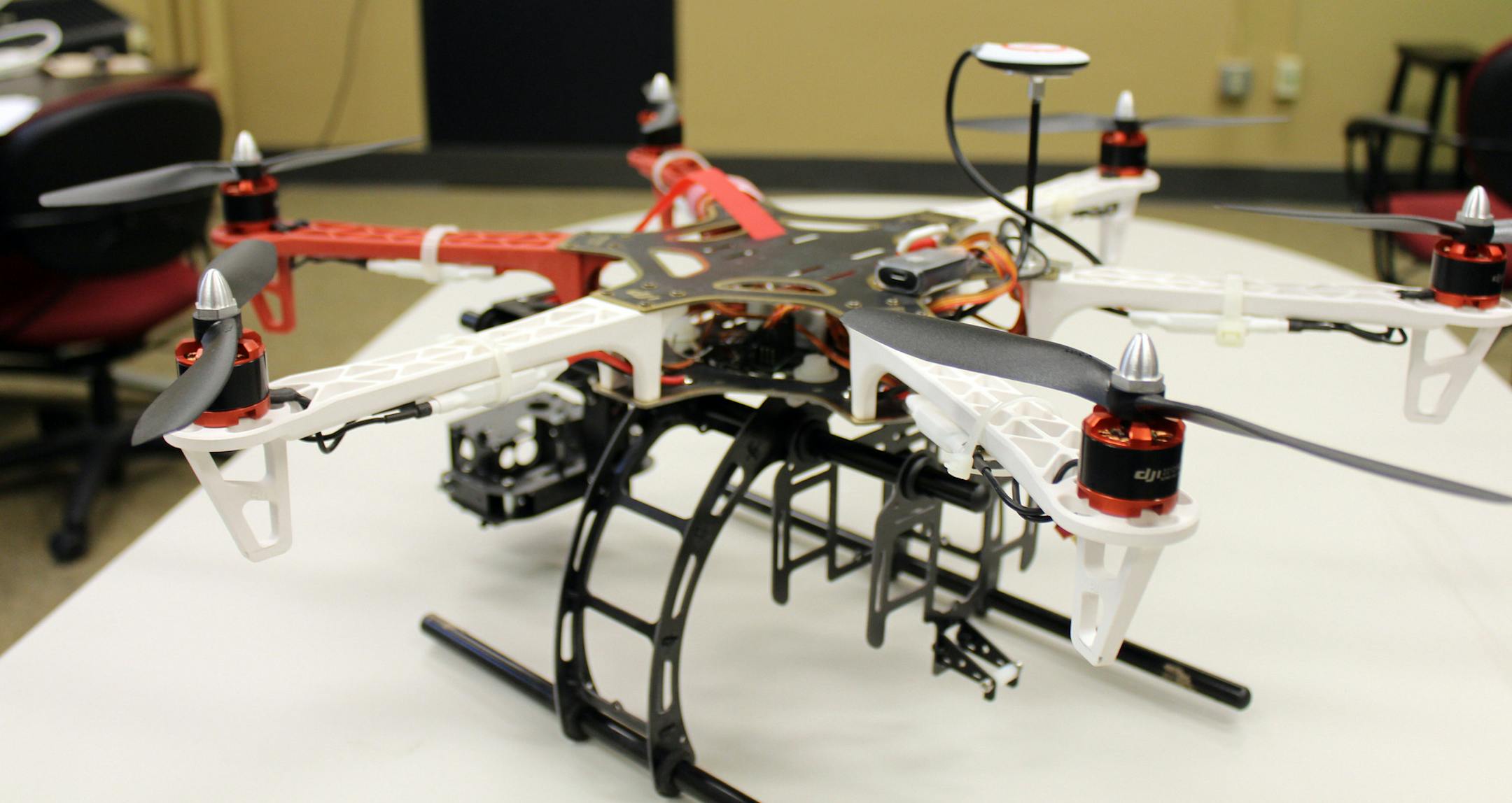 In this March 2012 photo provided by The University of Missouri, in Columbia, Mo., is a DJI 550 drone with an attached camera mount that the university says is probably the model it will file for permission to use. The FAA is developing new rules as the technology makes drones far more versatile, but for now operators can run afoul of regulations by using them for commercial purposes, including journalism. (AP Photo/University of Missouri, Zach Garcia, File)