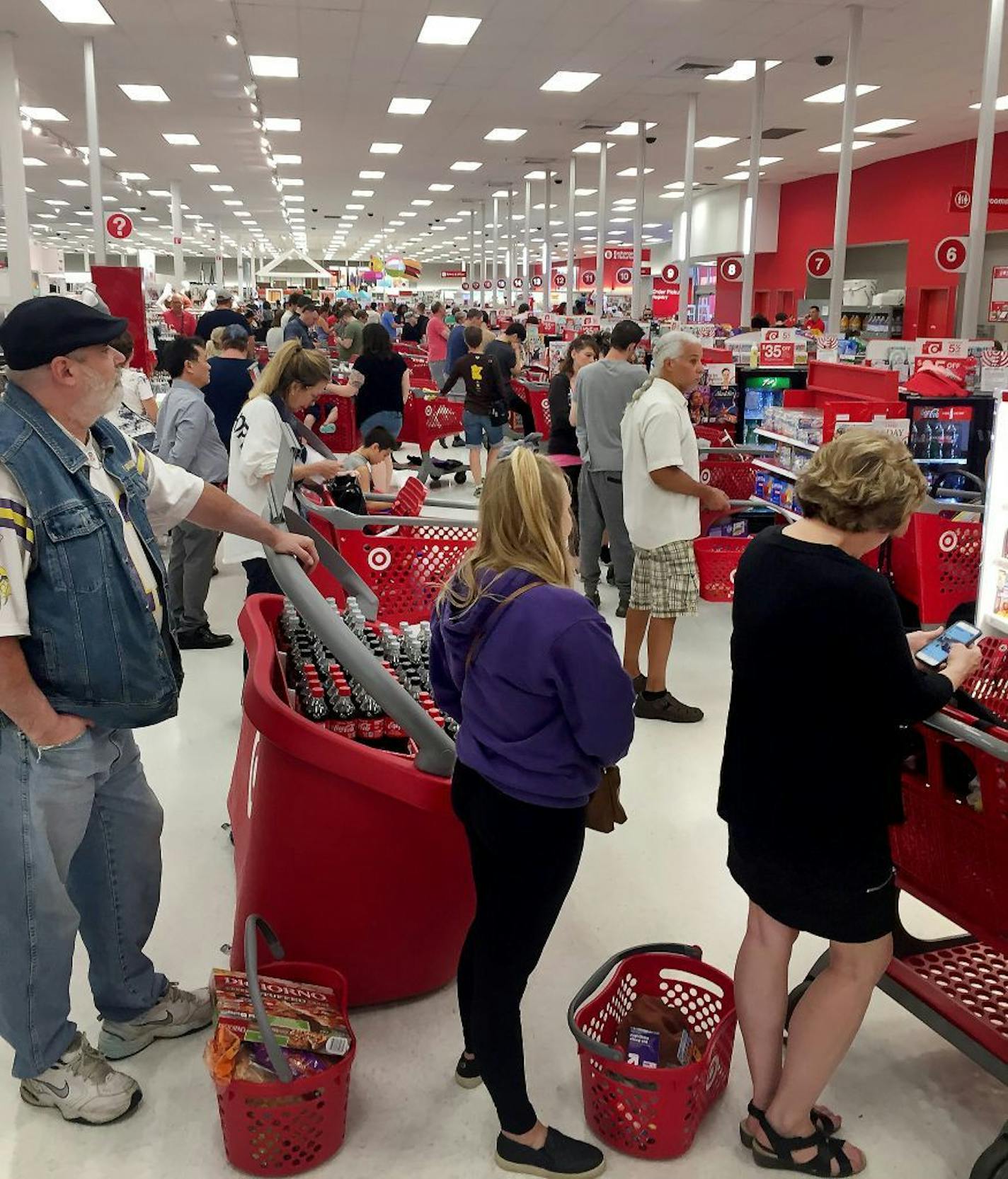 Shoppers waited for cash registers to come back online after a nationwide outage Saturday, June 15, at the St. Paul Midway Target.