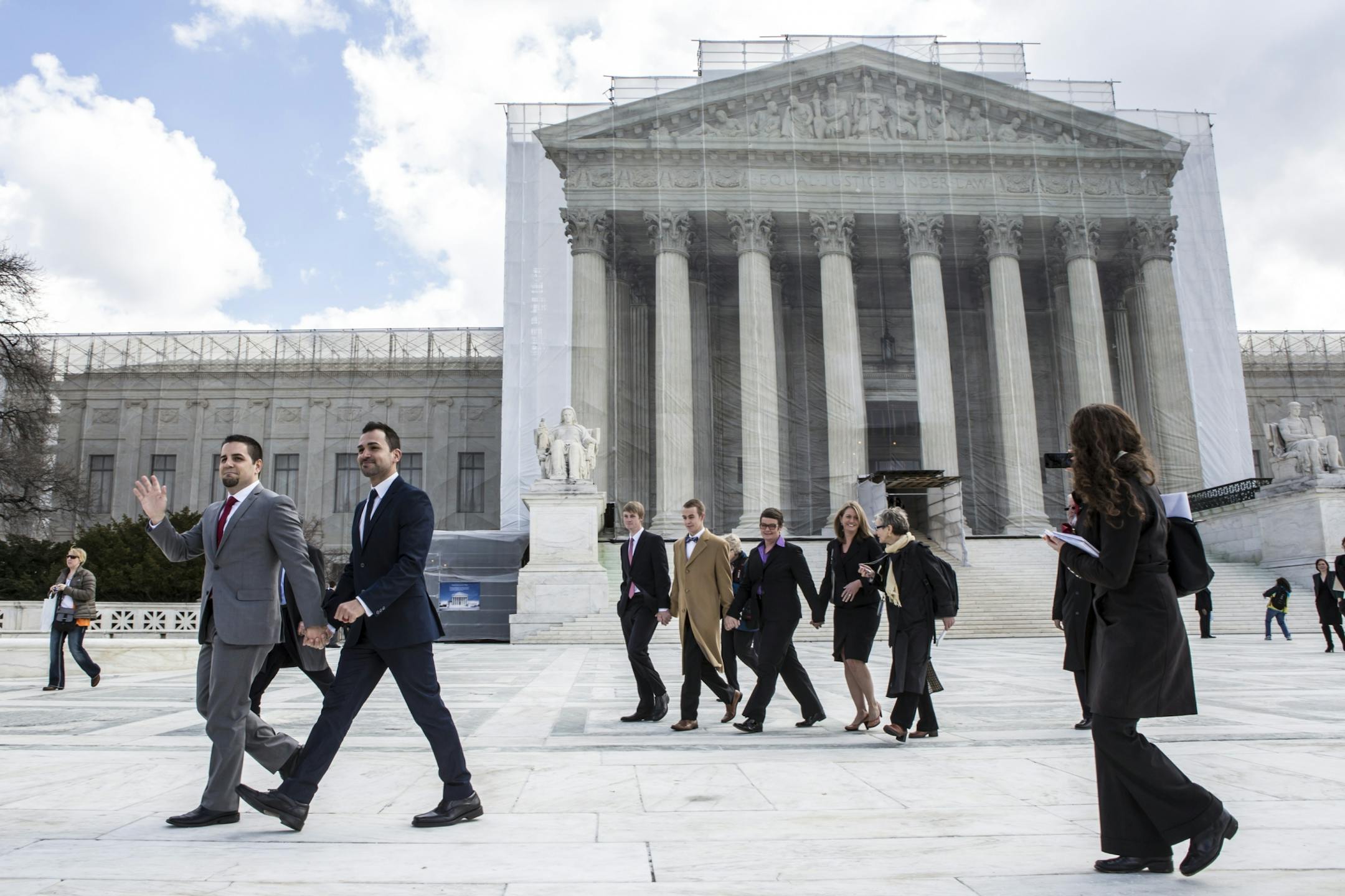 Plaintiffs Jeff Zarrillo, left, and Paul Katami exit the U.S. Supreme Court in Washington, March 26, 2013. As the court began hearing arguments in a challenge to California�s same-sex marriage ban Tuesday, Justice Anthony Kennedy spoke strongly about the interests of the children of gay and lesbian couples.