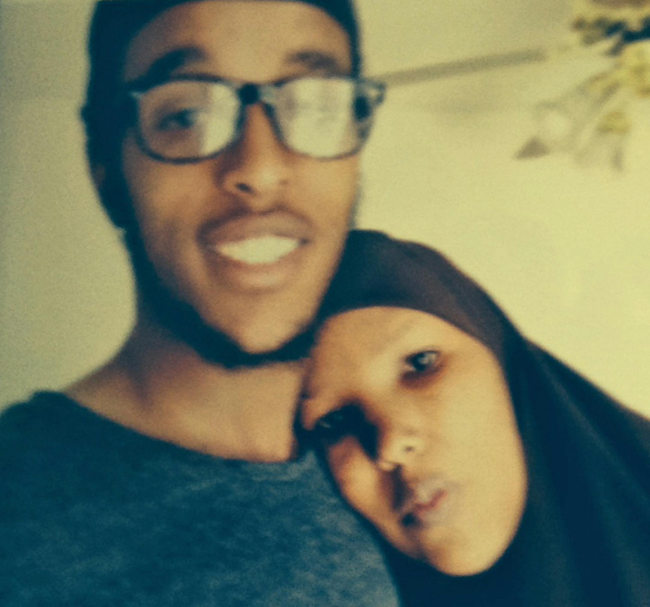 Photo of Abdi Mohamed Nur, 20, with his mother, Sadiyo Omar, both from Minneapolis. He was flew to Turkey last Saturday and believed to be traveling to Syria to join the civil war against the regime. Photo: Randy Furst - Star Tribune Minneapolis, MN 6/4/14 (Randy took photo of the mom's phone with the photo on it. )