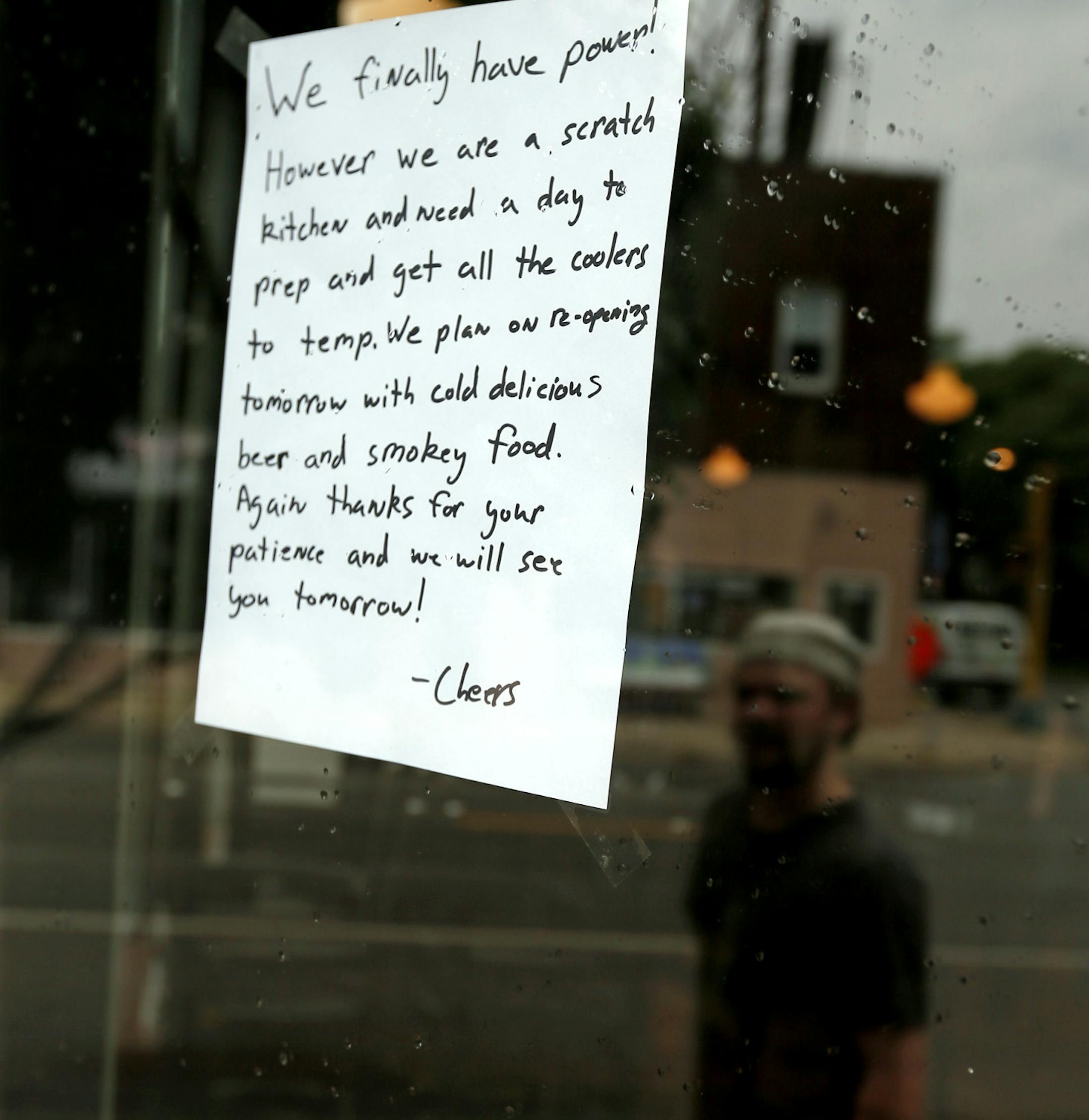 Employees at Northbound Smokehouse Brewpub getting ready to open their doors for business now that power has been resorted Monday June 24 2013. The Brewpub lost power in Friday's storm. ] JERRY HOLT ‚Ä¢ jerry.holt@startribune.com