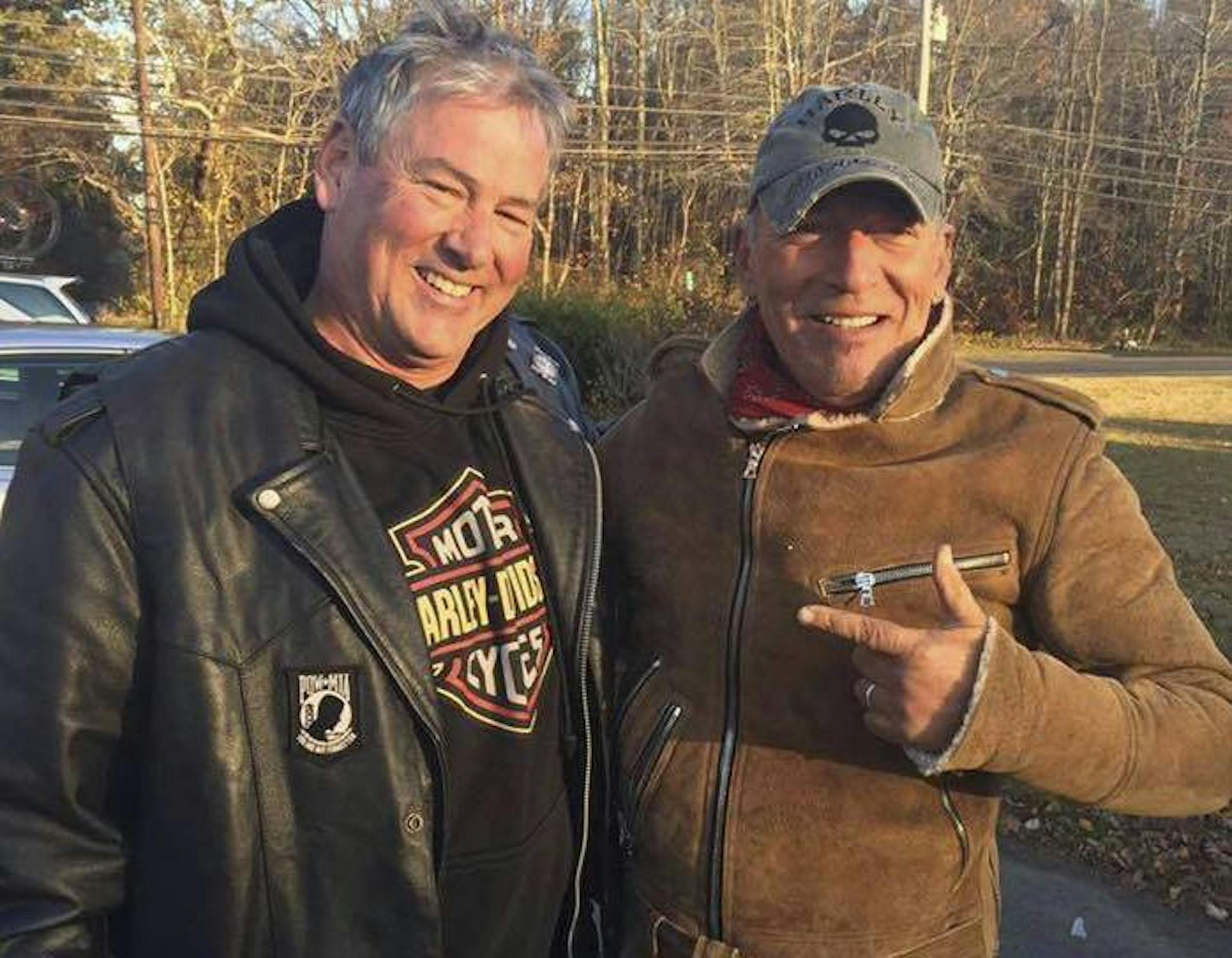 In this Friday, Nov. 11, 2016, photo provided by Ryan Bailey, Dan Barkalow, left, and Bruce Springsteen poses for a photo in Wall Township, N.J. Barkalow and a group from the Freehold American Legion was riding after a Veterans Day event Friday when they pulled over to help a stranded motorcyclist who turned out to be The Boss. (Ryan Bailey via AP)