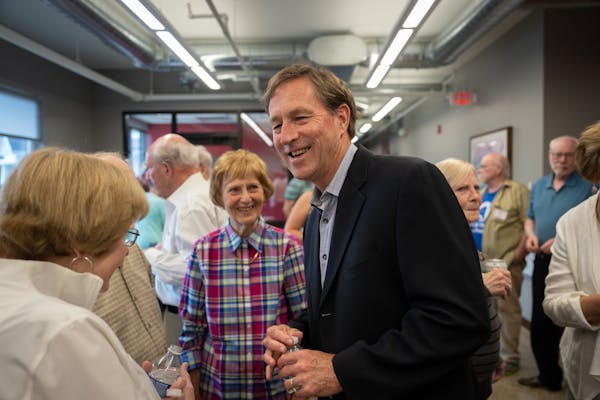 Democratic First Congressional District candidate and former Hormel Foods CEO Jeff Ettinger mingled at a fundraiser at the law offices of Maschka, Rie