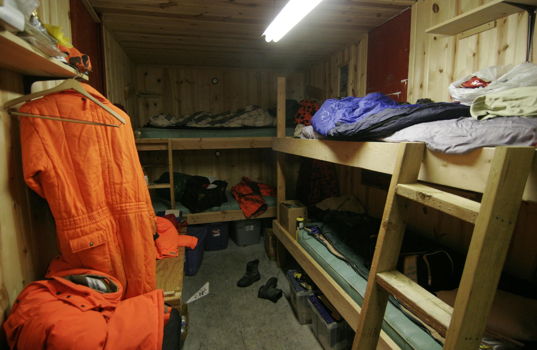Bunk beds and a futon provide sleeping space for about seven hunters at Rick Storck's railroad car hunting shack. Photo by Doug Smith/Star Tribune