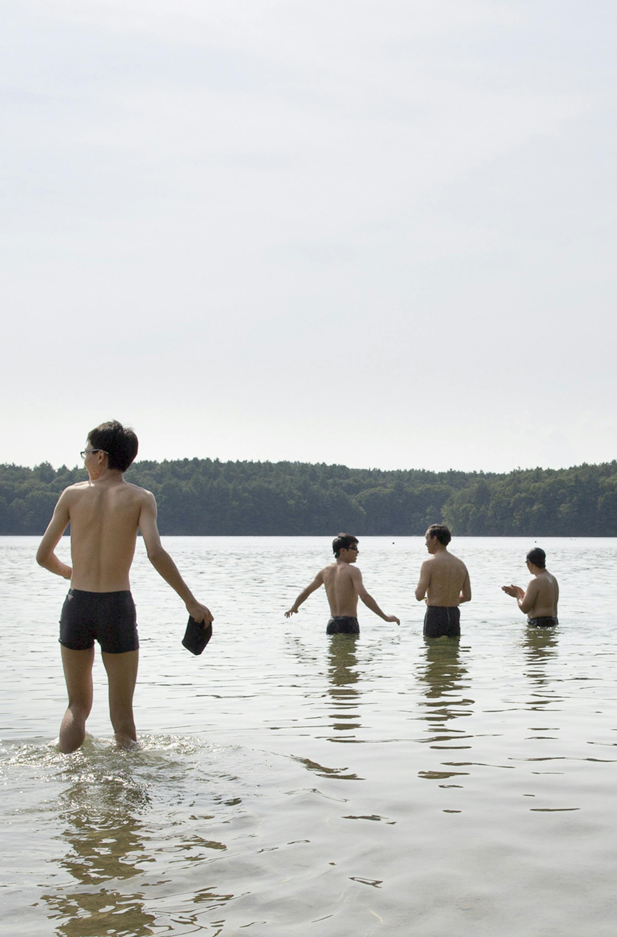 Visitors bathe at Walden Pond, Henry David Thoreau's idyllic retreat near Concord, Mass., Aug. 24, 2012. Despite 21st-century conveniences, the original Walden Pond in the woods of Concord, Mass., remains hard to find, as some GPS devices have been wrongly leading a distributary of travelers to an identically named body of water in Lynn., Mass. (Evan McGlinn/The New York Times)