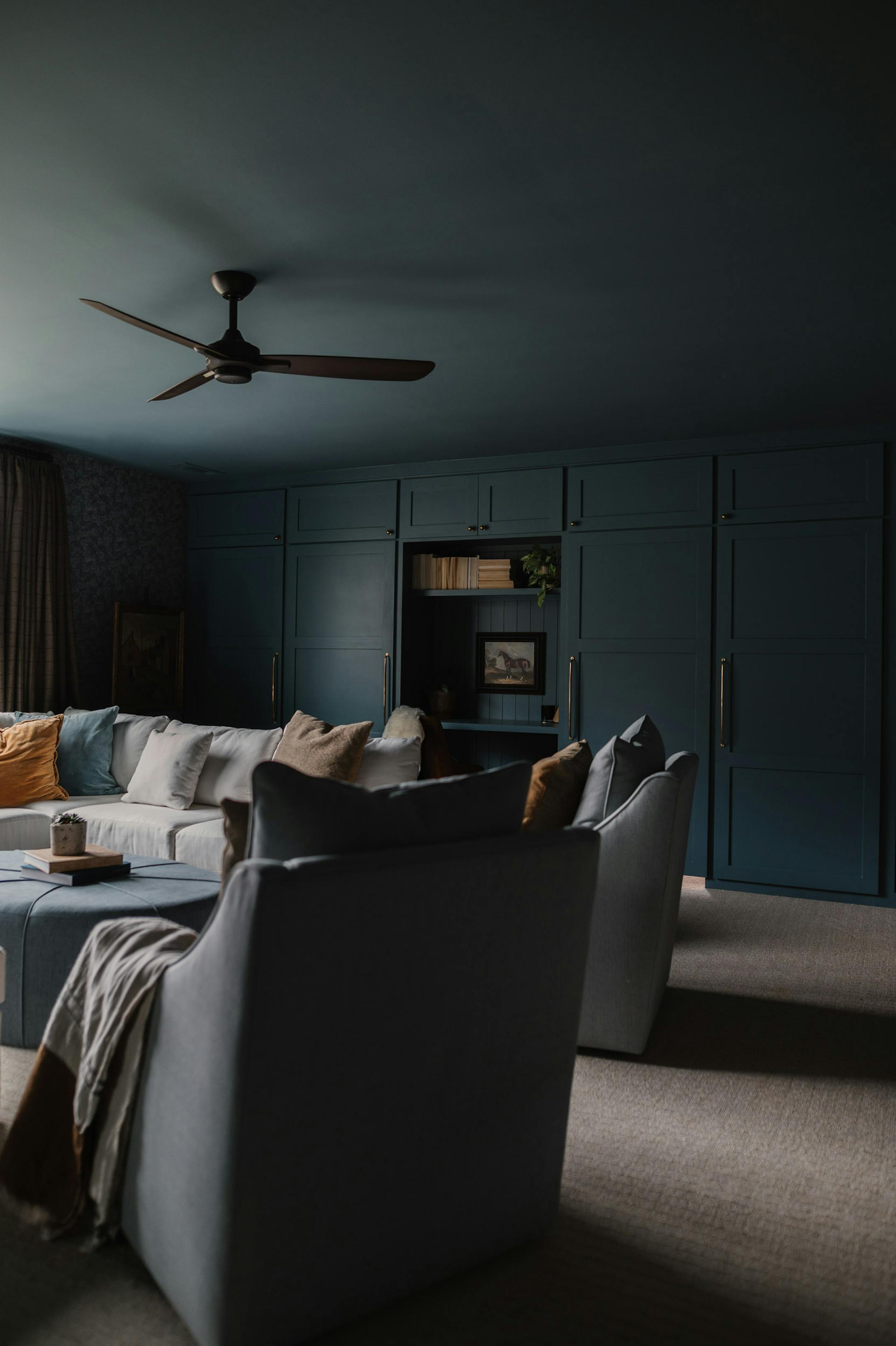A door camouflaged by built-ins and wall paneling in Hunter Premo's bonus room hides a secret play area for her sons. MUST CREDIT: Photo by Erin Bratcher