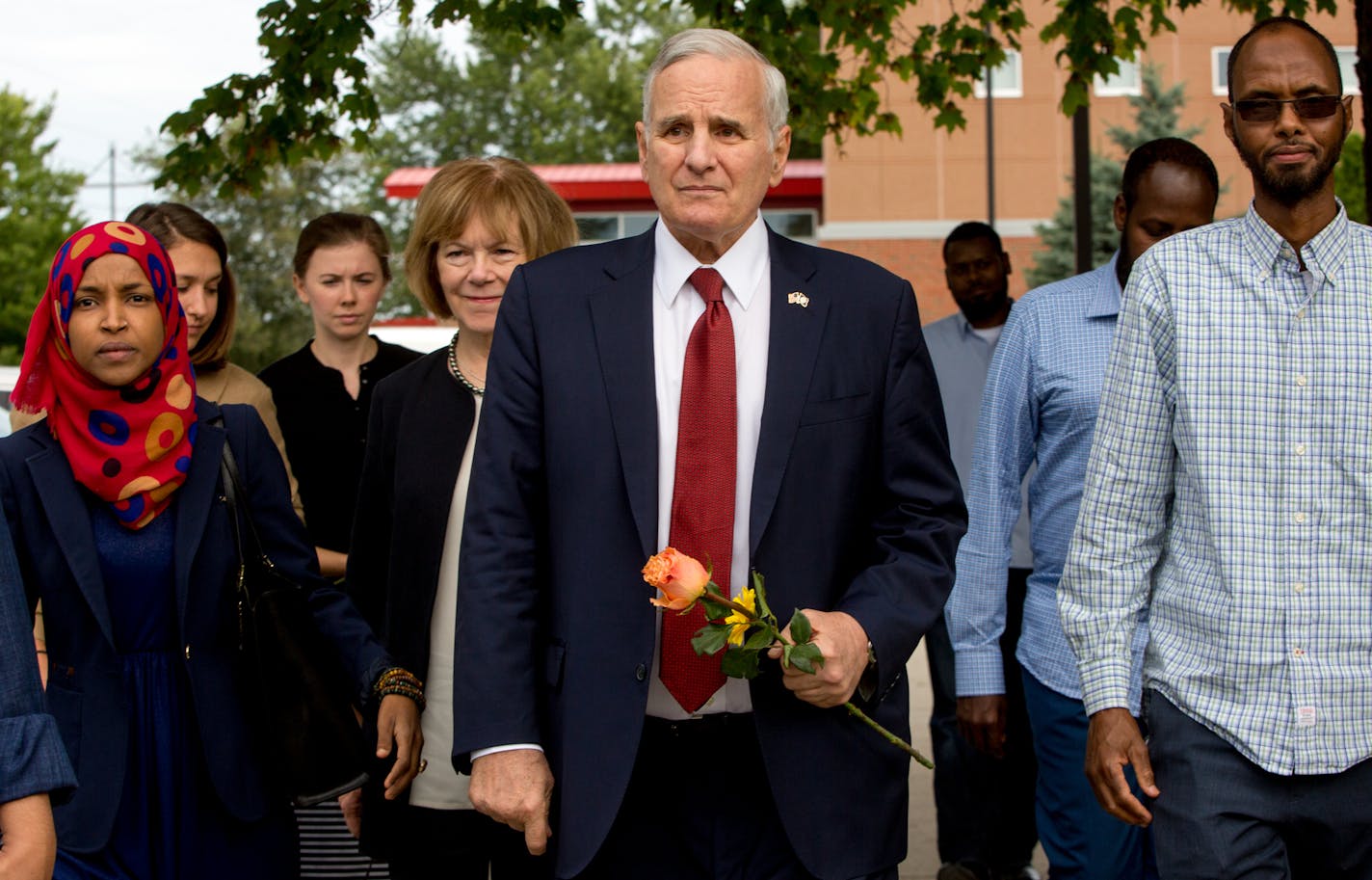 Gov. Mark Dayton (center) arrives at the Dar Al Farooq Islamic Center to speak with the community, on Sunday. ] COURTNEY PEDROZA &#x2022; courtney.pedroza@startribune.com; Dar Al Farooq Islamic Center; Gov. Dayton visits on Sunday; Bloomington, MN; Aug. 6, 2017.