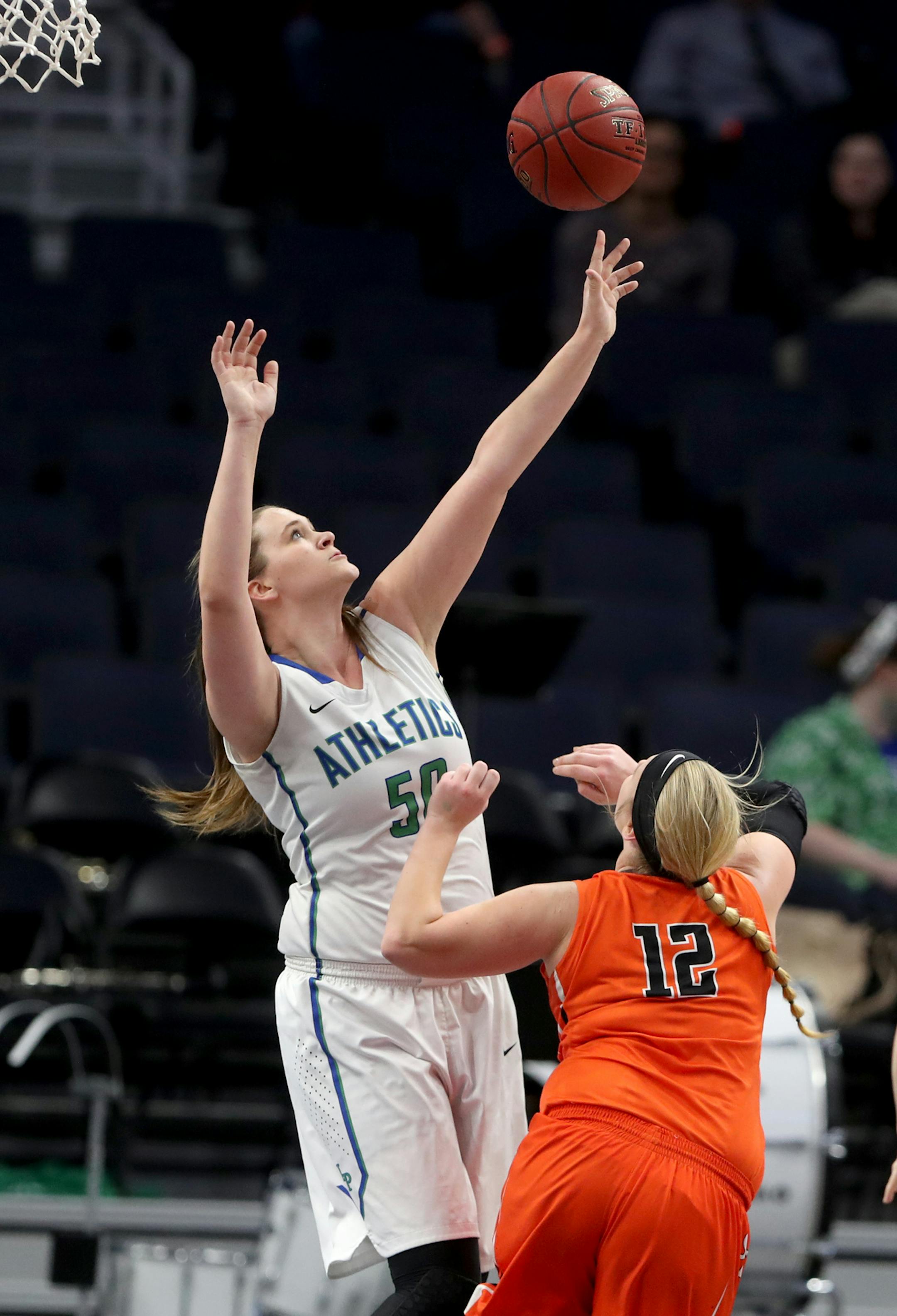 Lyle-Pacelli's Kristi Fett (50) blocks a shot by Sleepy Eye's McKenzie Cselovszki (12) during the first half of the 1A girls' basketball state championships Saturday, March 17, 2018, at Target Center in Minneapolis, MN.] DAVID JOLES ï david.joles@startribune.com Lyle-Pacelli and Sleepy Eye 1A girls' basketball state championships