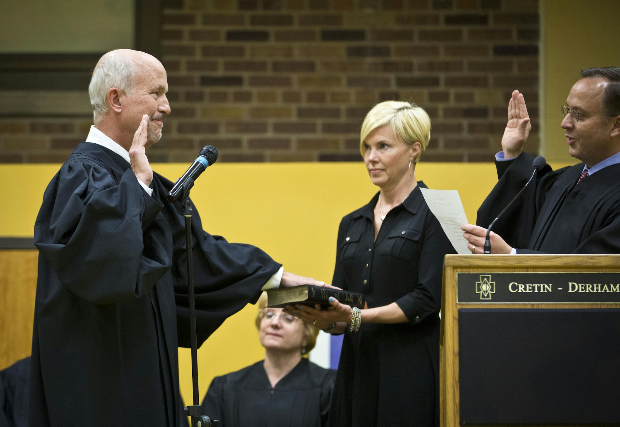Judge Edward J. Cleary, left, was sworn in as chief judge of the Minnesota Court of Appeals on Monday by outgoing Chief Judge Matthew E. Johnson, right, during a ceremony at Cretin-Derham Hall High School in St. Paul.