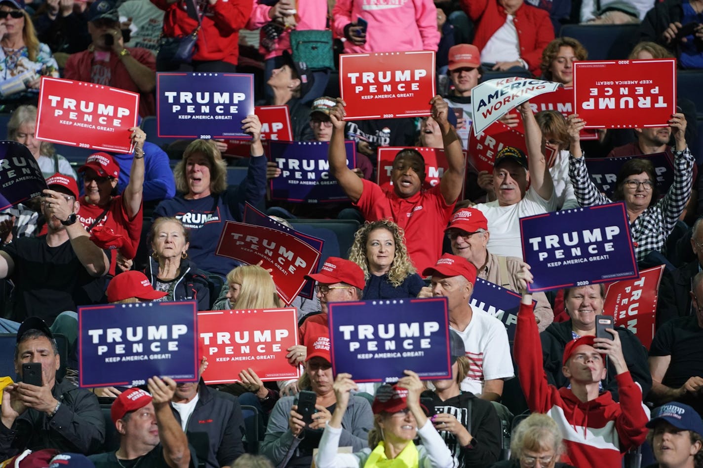 Trump supporters at Target Center cheered before the president's arrival for his campaign rally Thursday evening.