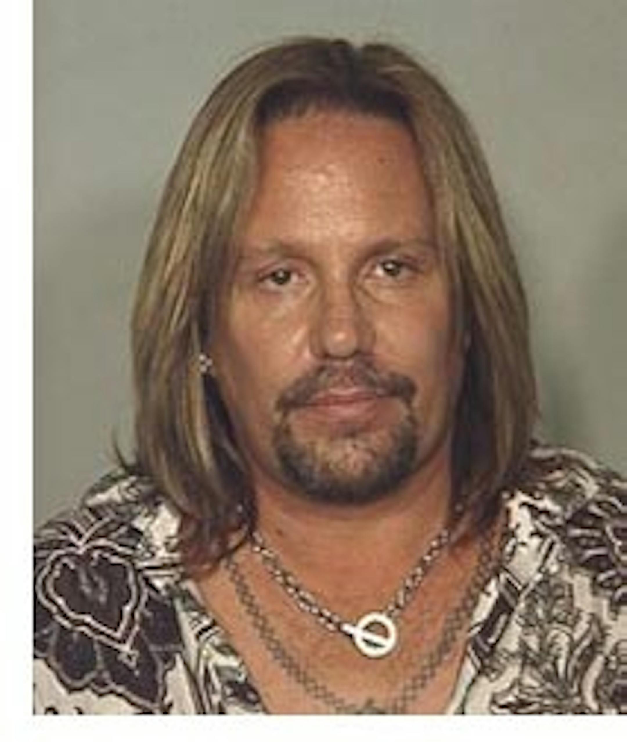 FILE - This June 28, 2010 file photo released by the Las Vegas Metropolitan Police Department, shows Motley Crue singer Vince Neil, who is heading to court on Wednesday, Jan. 26, 2011 for a plea deal that gets him two weeks of jail time, plus two weeks of house arrest, for driving drunk last summer near the Las Vegas Strip. Police say Neil was stopped in his black Lamborghini last summer after leaving the Las Vegas Hilton, where he owns a bar. (AP Photo/Las Vegas Metropolitan Police Department, File)