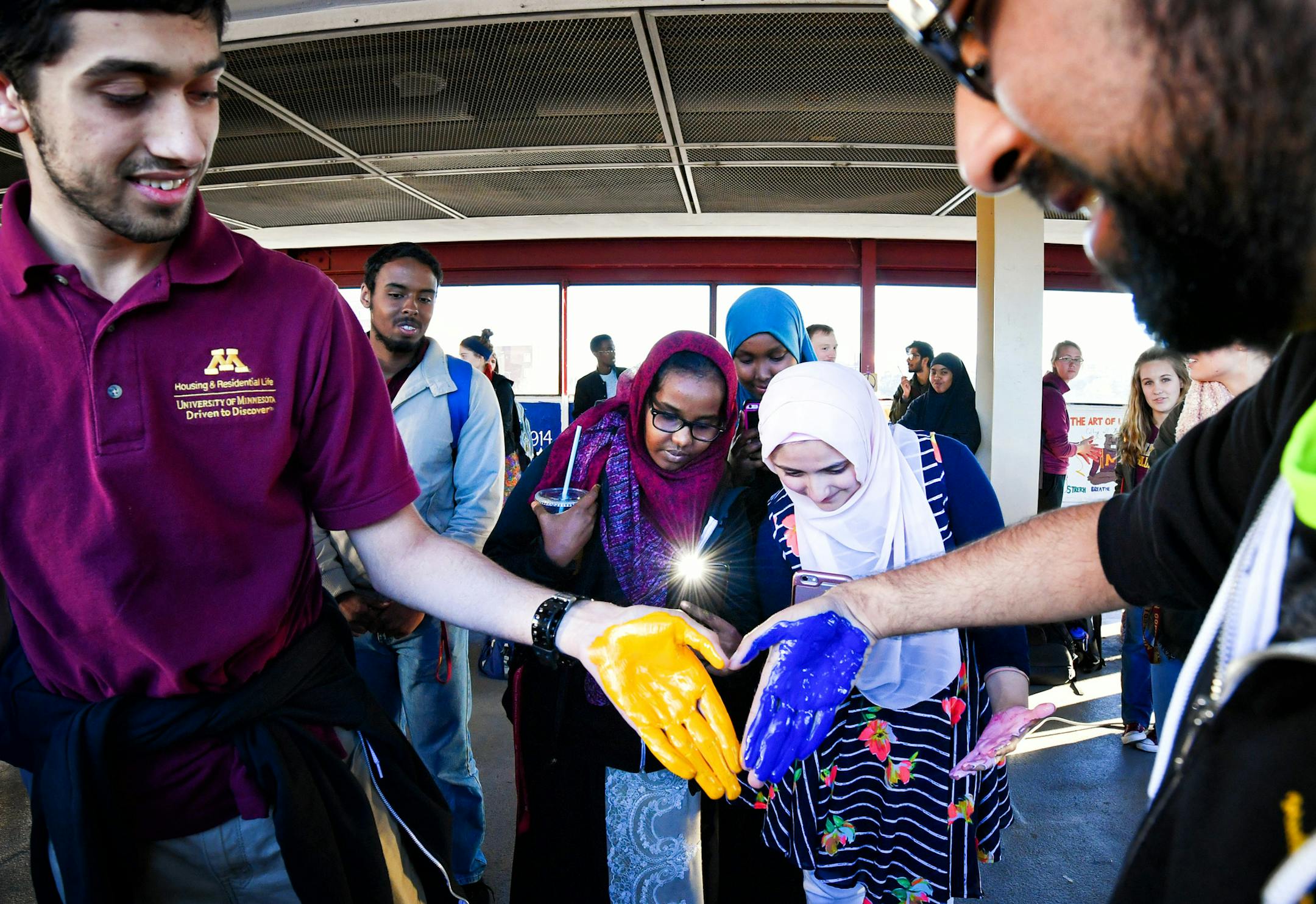 Faiz Jabir and Muhammad Islam prepared to leave their handprints on the repainted panel. ] GLEN STUBBE * gstubbe@startribune.com Friday, November 11, 2016 Muslim students association and others repaint the MSA panel on the bridge, friday 3-6pm. It had been defaced with graffitti. Please join us as we repaint our bridge panel following the defacing of our panel last week. We are extending the invitation to everyone, as we would like to create a community painted panel so that we can show that big