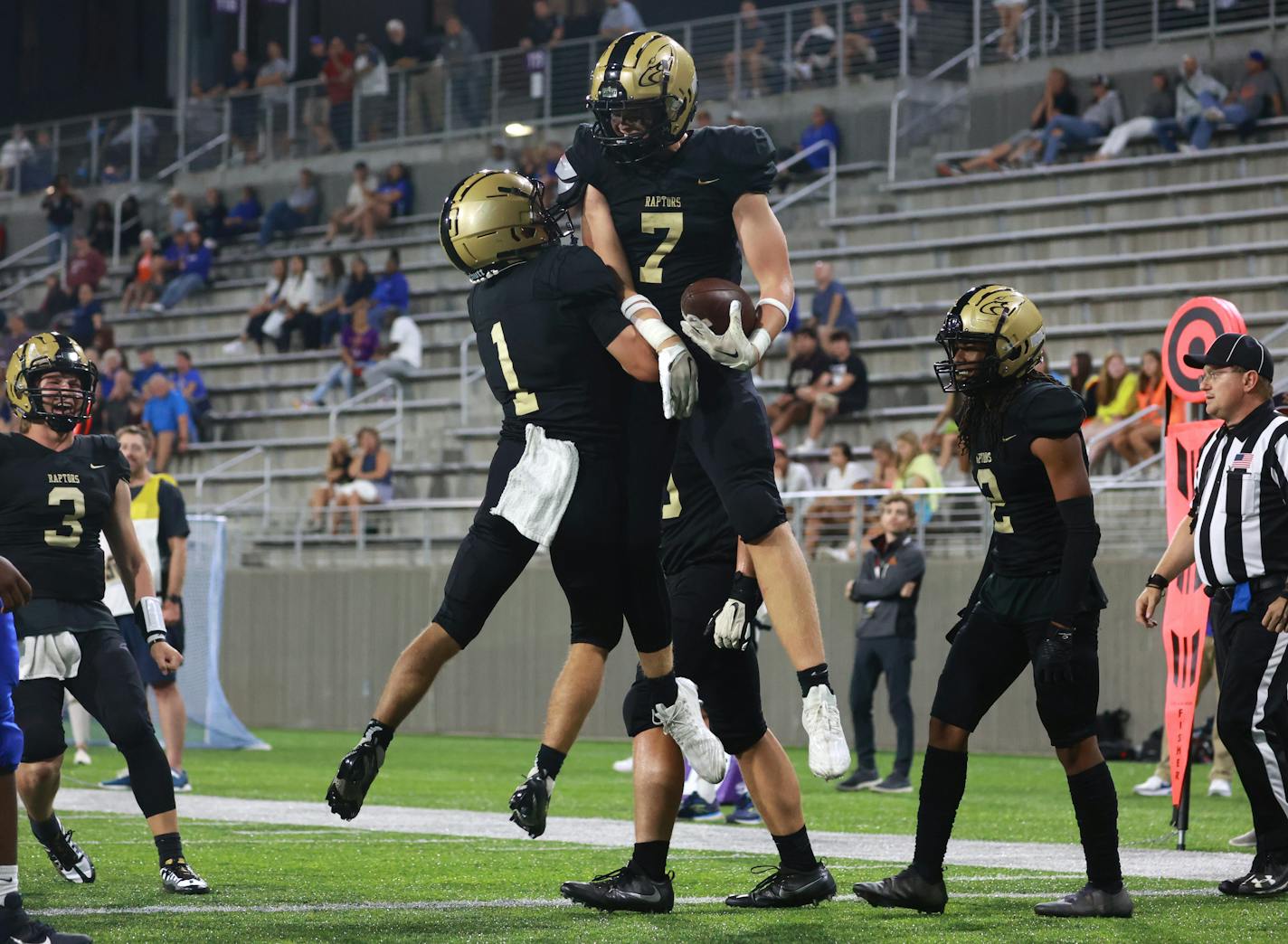 East Ridge players Riley Schwellenbach (1) and Jack Tharaldson (7) celebrate Tharaldson's touchdown reception in the third quarter. Photo by Cheryl A. Myers