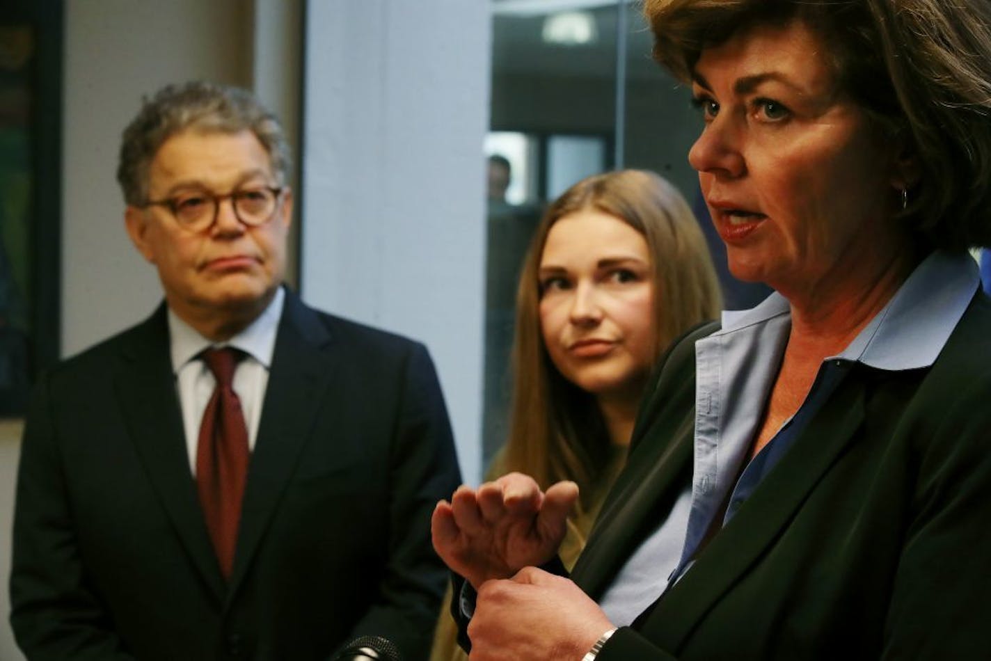 Sen. Al Franken and Abby Honold looked on in October 2017 as Beth Roberts, a retired police officer, talked about legislation aimed toward better training of officers who investigate sexual assault.