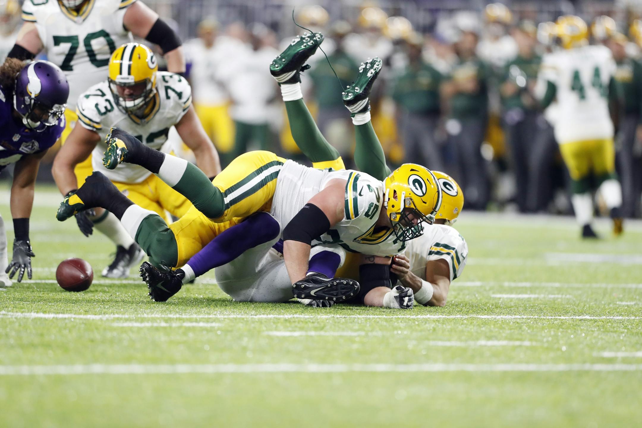 Green Bay Packers quarterback Aaron Rodgers (12) fumbled the ball as he was sacked Minnesota Vikings defensive end Danielle Hunter (99) in he first quarter at U.S. Bank Stadium Sunday September 18 ,2016 in Minneapolis, MN.