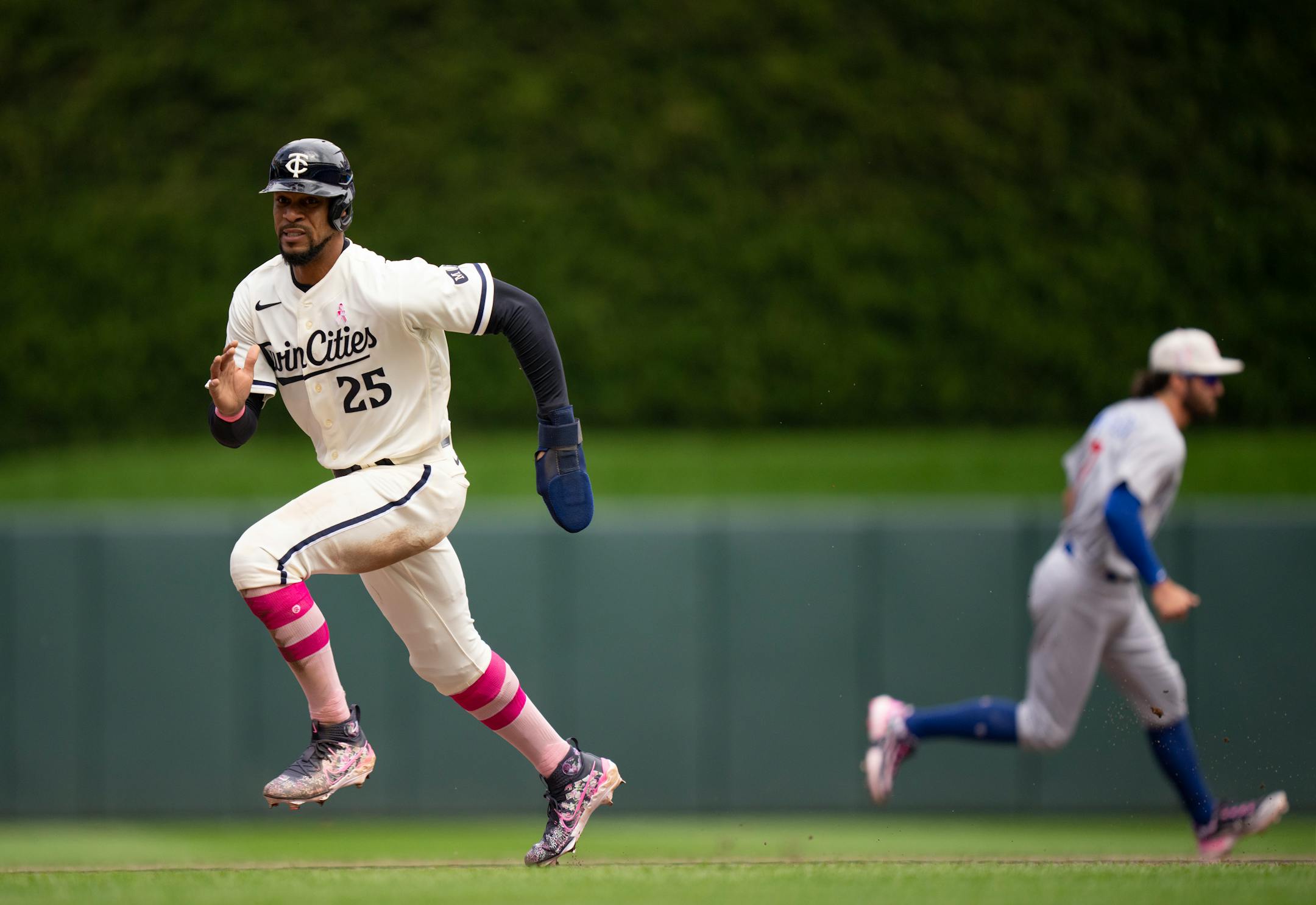 Minnesota Twins designated hitter Byron Buxton headed home to score on a Kyle Farmer single in the seventh inning.